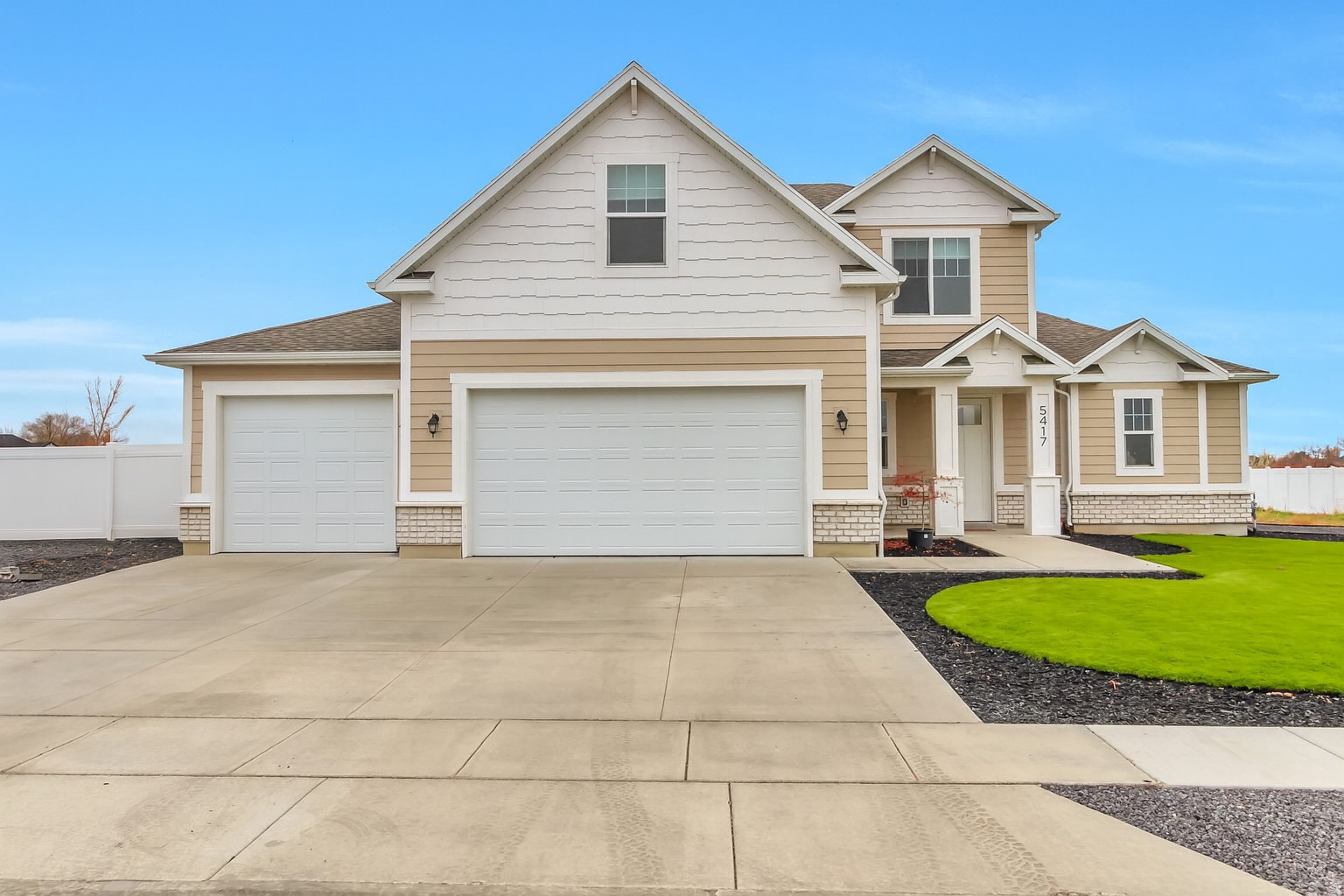 This nearly new home, situated on a half-acre rectangular lot, offers a quiet country feel, but is still located within close driving to retail stores.  The expansive great room features a two-story ceiling and floor-to-ceiling windows that flood the space with natural light, creating an open atmosphere.  Add to that, a modern kitchen with quartz countertops, double ovens, built-in gas range, and an island perfect for gathering around with family conversation.  The primary bedroom is conveniently located on the main floor, offering a single-level living lifestyle. The comfort of the home is enhanced with an additional AC unit dedicated for the second floor.  In the front and side yards, enjoy $40,000 in professionally designed landscaping, finished with a combination of turf, rock, and bark for a clean, low-maintenance, and polished look.  The fully fenced side yard provides added privacy and is perfect for pets, play, or quiet outdoor relaxation.  Square footage was taken from the county records.  Buyer is advised to verify all information.