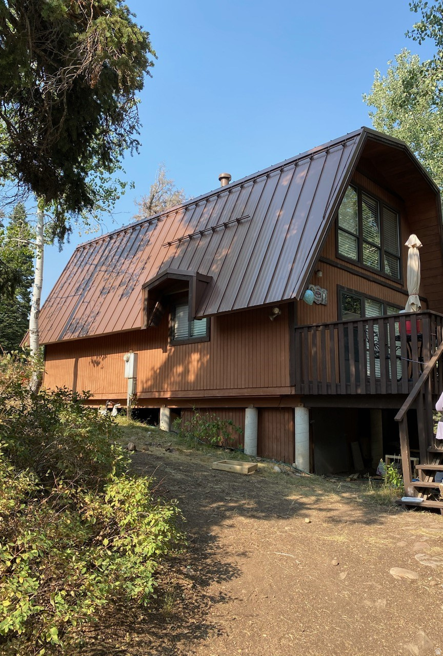 GREAT PRICE REDUCTION!  Enjoy you summer in a lovely Tollgate Canyon Cabin.  Incredible Getaway or year round residence.  Easy Access to shopping, recreation, lakes, skiing, hiking trails.  Main Floor Primary Suite fits Kingsize bed.  Slate Floors, New Roof.  Loft/Den with sleeping/bed allows for additional sleeping accommodations.  1 and 1/2 baths.  Furnished.  Surrounded by Pine Trees, Aspens and Wildlife.  Call Agent for keybox access code.