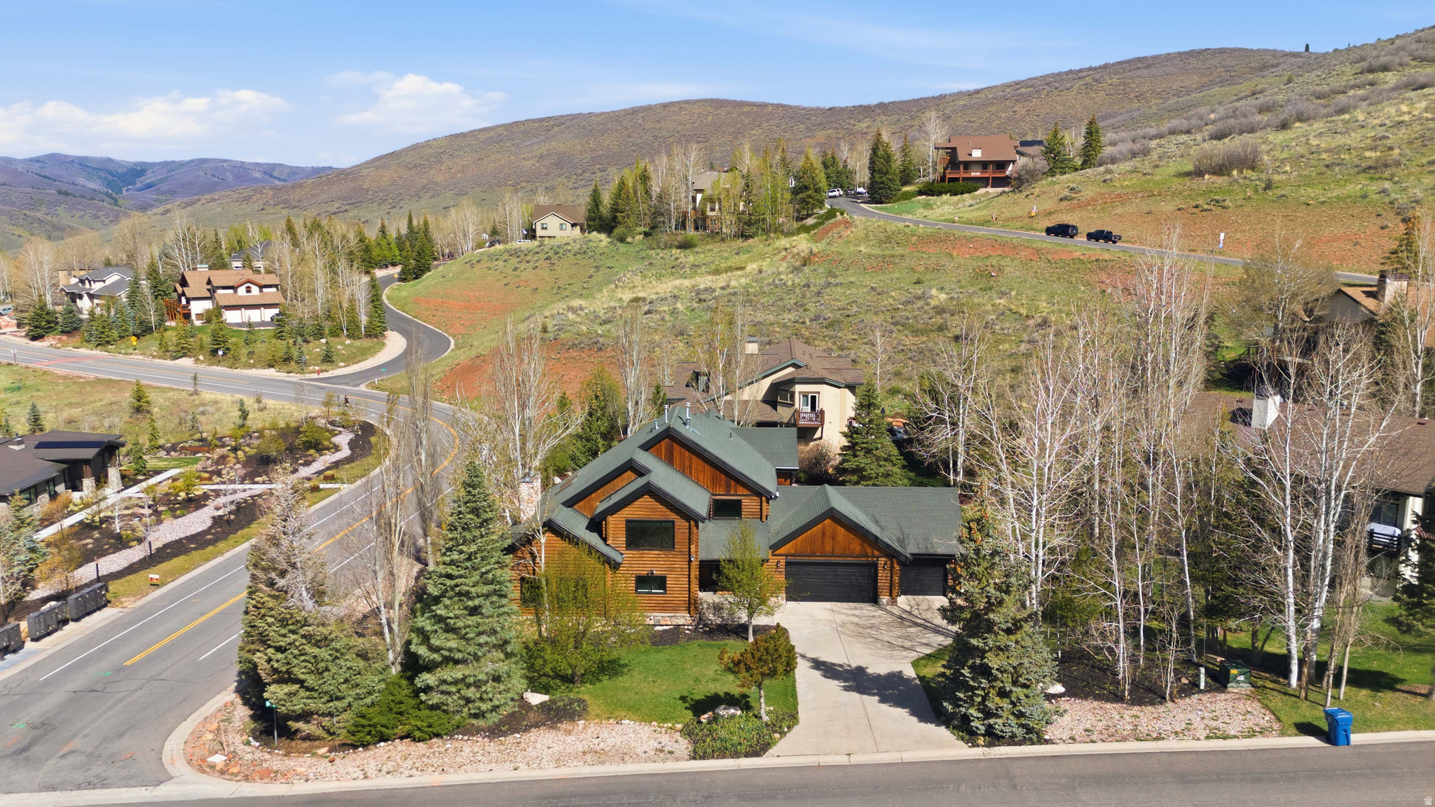 From 2,675,999. HUGE PRICE REDUCTION! Perched high atop Jeremy Ranch on a rare corner lot, this fully reimagined 2025 mountain-modern log home blends timeless alpine character with contemporary luxury. Situated in one of Park City's most coveted neighborhoods, the residence captures unobstructed panoramic views of Park City, Canyons, and Deer Valley ski resorts from a serene, private setting at the top of Daybreaker Drive.  A comprehensive 2025 transformation infuses the home with modern comfort and refined design while honoring its log-home heritage. Every detail has been renewed-new windows, designer lighting, premium flooring, fresh interior and exterior paint, and updated electrical throughout-creating a home that feels both sophisticated and welcoming. The vaulted great room showcases signature log-beam craftsmanship and a dramatic stone fireplace framed by sweeping mountain views that fill the space with natural light.  The gourmet kitchen pairs luxurious Calacatta quartz countertops with premium appliances and beautifully refinished cabinetry, offering an elegant yet functional workspace that harmonizes with the home's warm wood tones. Five spacious bedrooms and three and a half designer bathrooms provide comfort for family and guests alike. The main-floor primary suite is a true retreat, featuring a private balcony, spa-inspired bath, and generous closet space.  Downstairs, a large entertainment lounge invites relaxation with a pool table, second fireplace, and space for movie nights or gatherings. The lower level also includes a private Au Pair or in-law apartment with its own entrance-ideal for guests, caretakers, or multigenerational living. A versatile bonus room can serve as a spa, sauna, gym, or additional bedroom depending on your needs.  Outside, the expansive deck and landscaped yard showcase unforgettable sunsets over the Wasatch Range. The enormous three-car garage plus extra guest and camper parking offer exceptional space for vehicles, toys, and gear. Within the Park City School District and minutes from world-class skiing, golf, hiking, and dining, this exceptional log-home retreat embodies the perfect blend of authentic mountain beauty, modern convenience, and timeless design-a rare find in one of Park City's most exclusive settings.