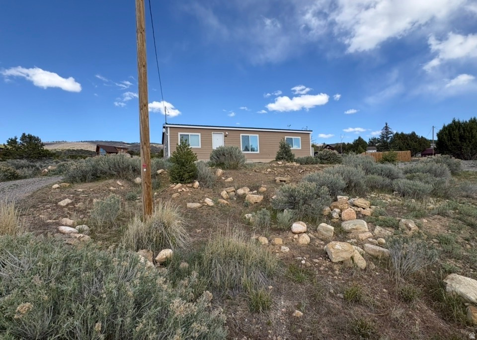 Fantastic main-level living on a spacious lot with beautiful views! This open-concept home on a foundation offers 3 bedrooms and 2 bathrooms, designed for comfortable everyday living. RV hookup and parking, too! Enjoy access to HOA amenities at Skyline Mountain Resort, including a pool, tennis courts, playground, golf course, and more. Square footage figures are provided as a courtesy estimate only and were obtained from county records. Buyer to  verify all information.