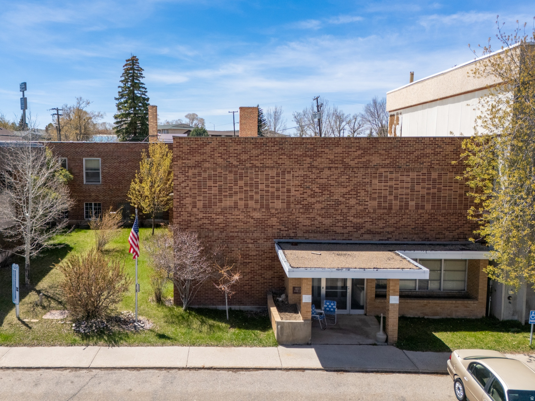 APEX Real Estate proudly presents a unique historic opportunity located at 1233 Uinta Street in Evanston, Wyoming. Formerly known as the Old Hospital, this 20,507 sq. ft. commercial property offers significant potential for redevelopment or investment. Originally constructed in 1960, the building features solid concrete construction and a durable brick exterior, providing a strong structural foundation for a variety of future uses. Zoned P-E (PublicEstablished), the property allows for a wide range of medical, office, and community-oriented applications. The two-level layout includes a rear loading dock and over 15 on-site parking spaces, making it well-suited for service-based operations. Its location is positioned between an active senior center and established senior living facilities, which enhances both visibility and accessibility within a high-traffic community corridor. While portions of the electrical system have been updated, the property will require renovation and modernization. Some original components remain, and buyers are encouraged to conduct their own due diligence regarding any environmental or safety considerations. Offered at $330,000, this property is a value-driven opportunity for investors or developers seeking a substantial structure with strong adaptive reuse potential. The property is being sold strictly as-is, where-is, and is available for cash purchase only. Buyer and buyer's agent to verify all information.