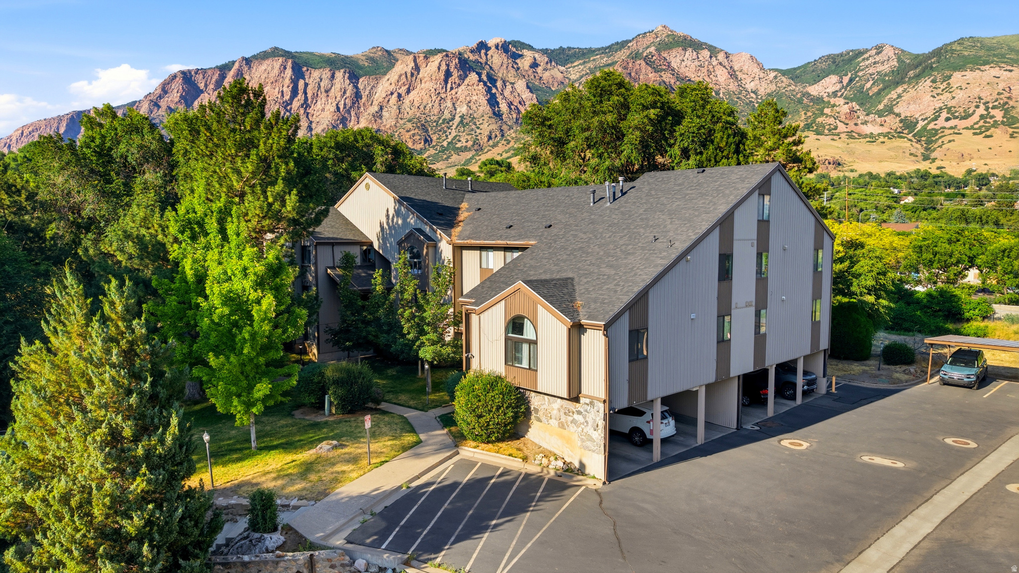 Charming 2 bedroom condo in the desirable Millstone Manor community! This beautiful suite boasts a larger living room as well as 2 entry doors. Updated within the last 5 years; flooring, carpets, paint and water heater were replaced. This move in ready home offers comfort, convenience, and breathtaking mounting views, located near the mouth of Ogden Canyon.  Access to a gated community pool and close to everything northern Utah has to offer, with nearby hiking and biking trails, Pineview Reservoir and several ski resorts. Square footage figures are provided as a courtesy estimate only and were obtained from County records. Buyer is advised to obtain an independent measurement.