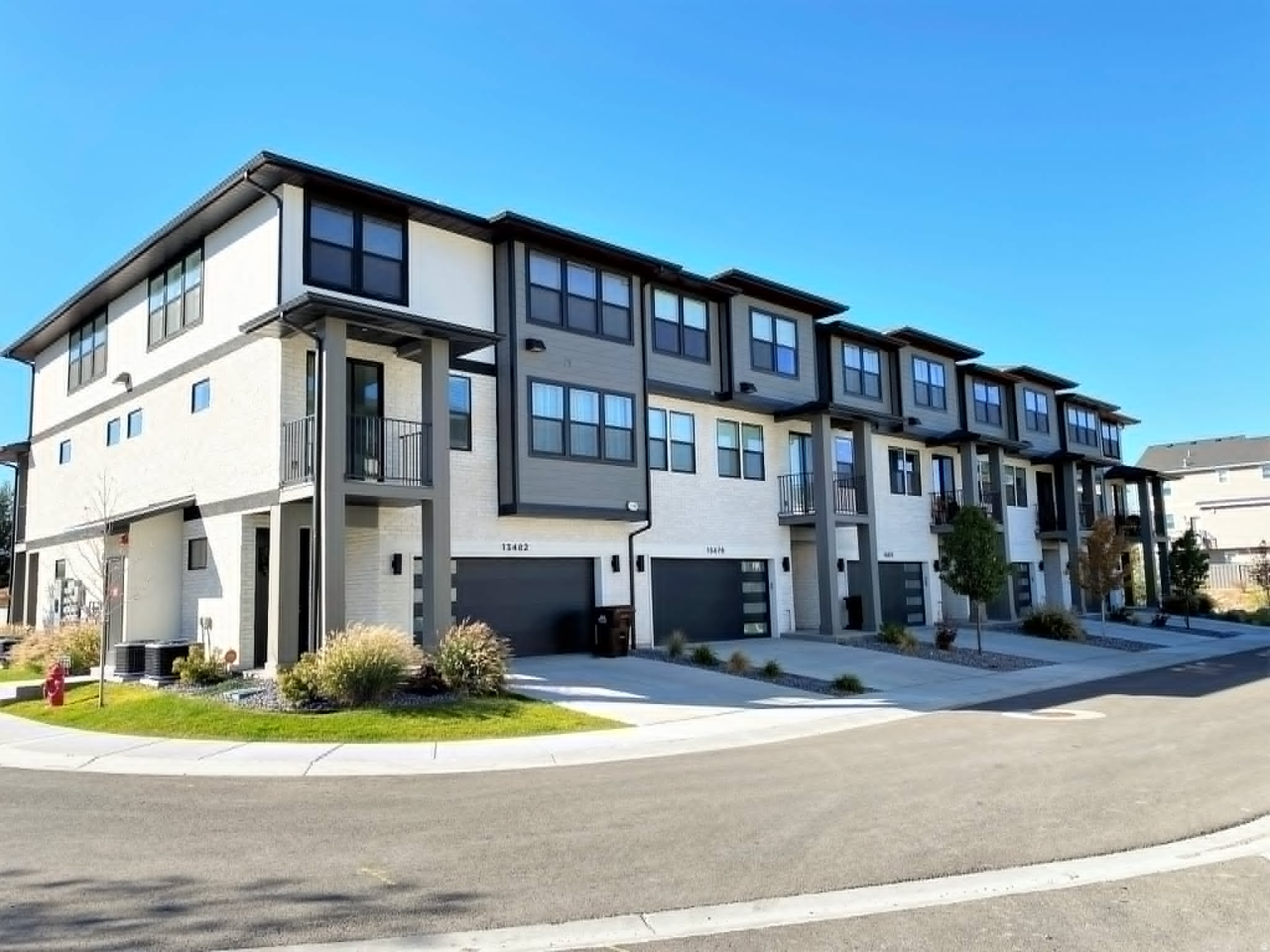 Welcome to this beautifully designed newer townhome in the heart of Draper, in an unbeatable location. The open-concept main living area is filled with natural light and centers around a stunning kitchen featuring stainless steel appliances and an oversized island-ideal for entertaining or everyday living. Upstairs, the spacious primary suite offers a true retreat with an expansive walk-in closet and well-appointed ensuite bath. Additional highlights include a private balcony, perfect for relaxing outdoors, and a two-car garage with durable epoxy floors for a clean, finished look. Located just minutes from world-class outdoor recreation, you'll enjoy quick access to Corner Canyon's renowned hiking and mountain biking trails, the Draper Dog Park, and convenient freeway access for an easy commute.
