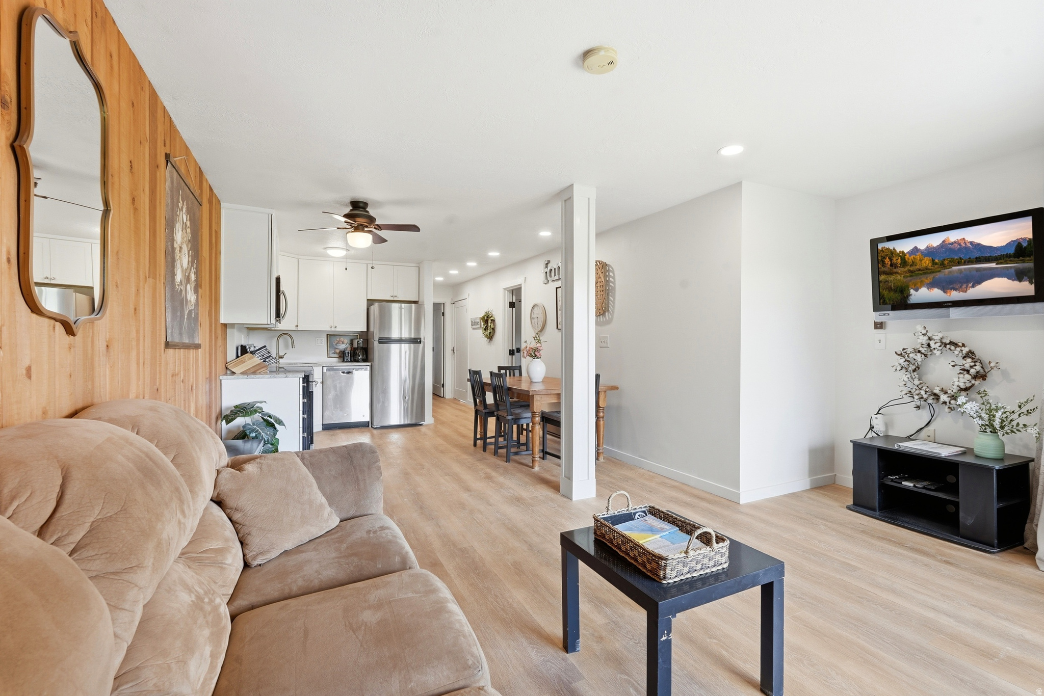Beautifully updated Bear Lake retreat with direct walkout access to the lawn, beach, lake, and resort amenities from two separate sliding glass patio entrances. This fully furnished condo features an updated open layout with spacious living areas, remodeled kitchen, stone countertops, upgraded cabinetry, and modern finishes throughout. Large windows and patio access create a bright and inviting space while capturing relaxing lake and mountain views. The updated design, combined with easy ground-level access, makes this an ideal setup for personal enjoyment, vacation use, or investment potential. Located alongside neighboring units also available for purchase, creating a rare opportunity for multiple families or groups looking to own adjoining properties in one of Garden City's most sought-after beachside locations.  Recently updated with a brand-new metal roof and currently participating in the established rental pool with strong summer bookings already in place. Buyer to honor existing rental pool participation through the current rental term ending September 7, 2026. An outstanding opportunity for personal use, investment potential, or for multiple families looking to secure adjoining units together in one of Garden City's most desirable resort locations. ****Square footage figures are provided as a courtesy estimate only and were obtained from county records. Buyer is advised to obtain an independent measurement.