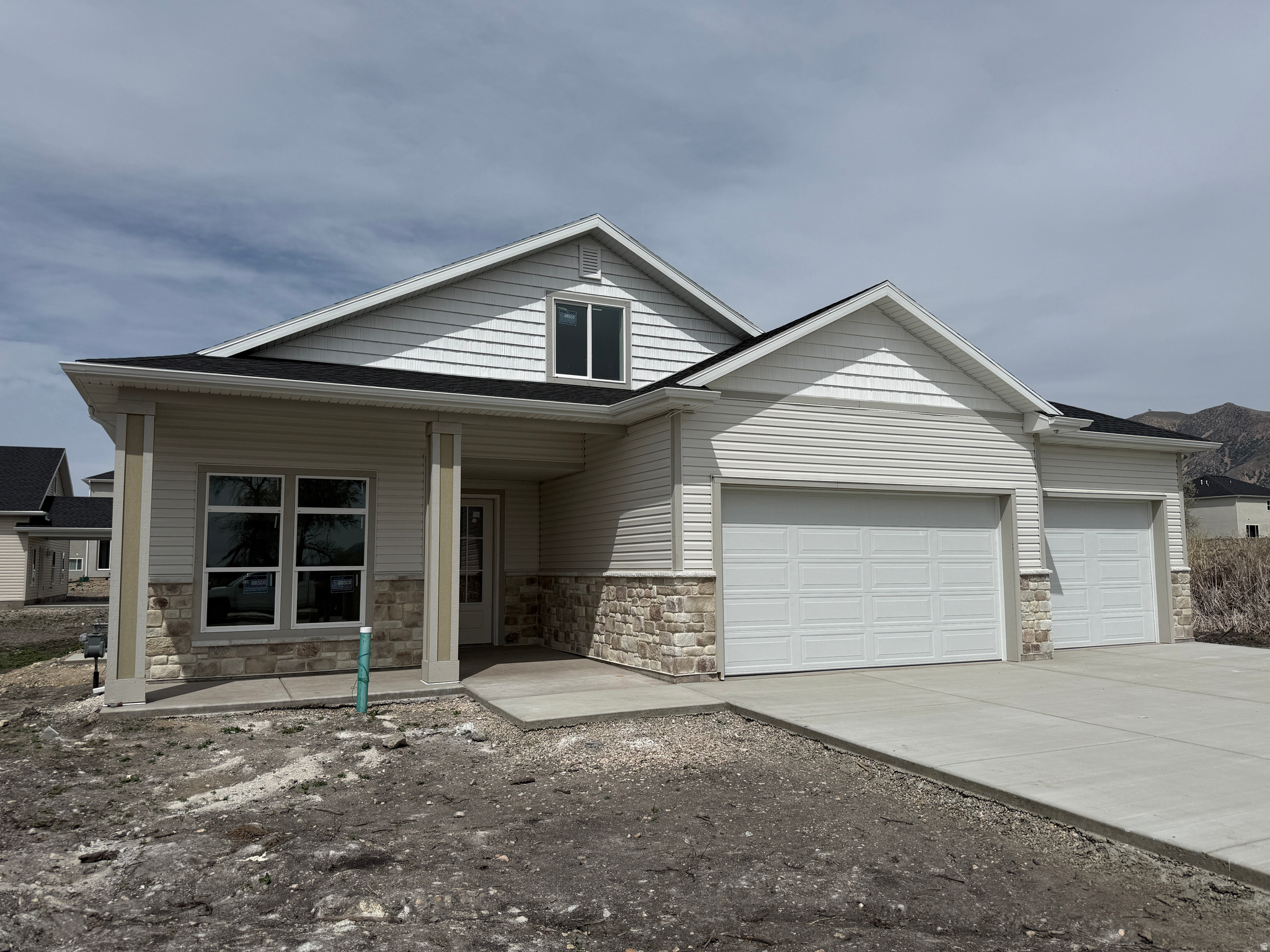 Amazing custom home with SINGLE LEVEL LIVING. Best of both worlds with a patio home main floor and large living area upstairs. Owners bedroom / bathroom suite, kitchen, family room and laundry are all on the main floor with a 2nd story with 2 bedrooms, family room and bathroom. This home features custom touches throughout, from the custom cabinets, quartz countertops, gas fireplace, walk-in pantry, large walk-in closets, high-end finish work, 3-tone paint, custom lighting, and so much more! All this on a nice South facing lot!  Home is under construction with a completion estimate of late June to mid July.