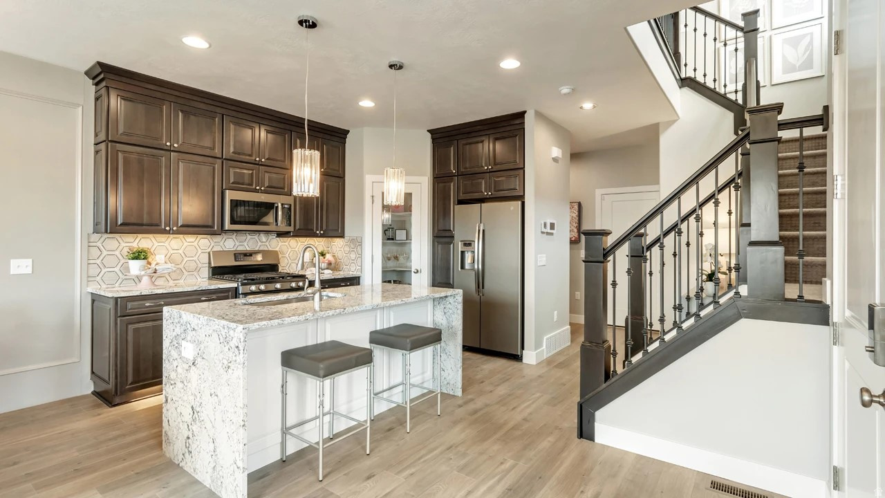 Welcome home to the Buchanan plan by Woodside Homes. This highly sought after community is close to everything you'll need. Front Runner, I15, shopping, restaurants, walking/biking trails, & more are just minutes from your door. The Buchanan plan is an END unit with tons of windows for added natural light, 9' ceilings on the main floor, inviting layout with wood laminate flooring, stainless kitchen appliances, tile in the baths, 2-tone paint, tankless/on-demand hot water & so much more. This floorplan is a DOUBLE master perfect for roommates, sisters or baby nursery!  Home will be completed in JUNE. Don't miss out on the opportunity to love where you live in Meadowbrook. **Photos are of decorated model home-upgrades/finishes will vary** Don't forget to ask about our awesome preferred lender incentives (rates as low as 3.75%!) to help make your dreams of home ownership a reality. #431 Buchanan. Visit the 6 decorated model homes at 853 West 560 South in American Fork!