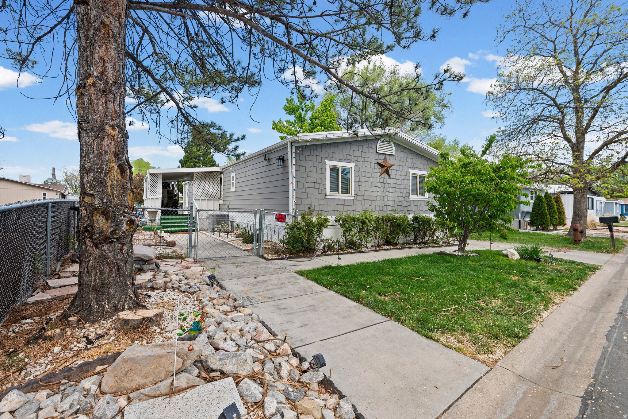 This spacious 4-bedroom, 2-bathroom mobile home offers approximately 1,440 square feet of comfortable living space, perfect for growing families or those who love to entertain. Recent updates include a brand-new A/C unit and new carpet throughout, giving the home a fresh, move-in-ready feel. The community also features great amenities, including a pool, clubhouse, and playground for residents to enjoy. It won't last long!   Square footage figures are provided as a courtesy estimate only and were obtained from Seller.  Buyer is advised to obtain an independent measurement.