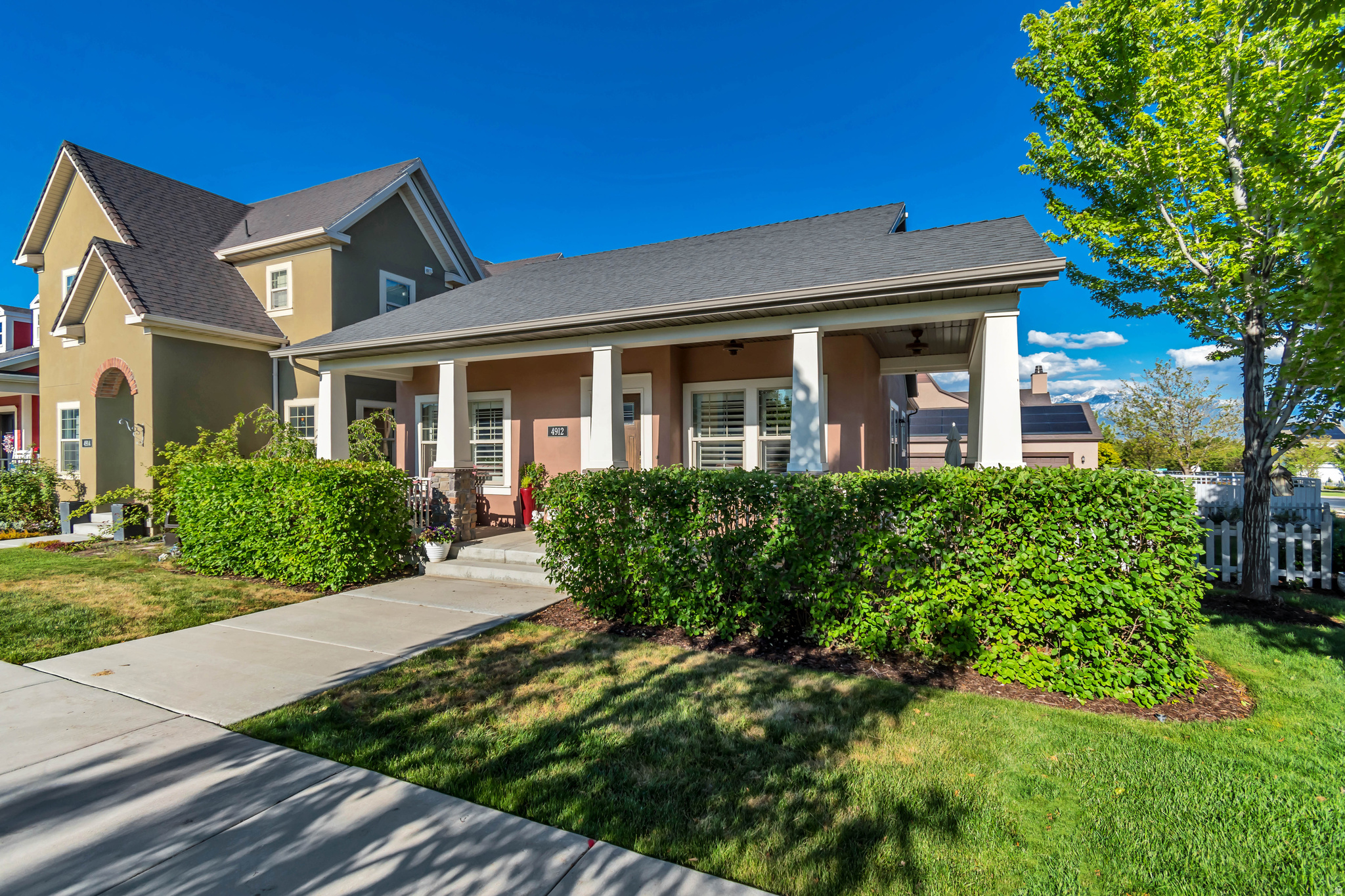 OPEN HOUSE 12-2 SATURDAY 5/30! Welcome to this beautifully maintained home in one of Daybreak's most desirable locations! Situated directly across the street from Brookside Park, scenic walking trails, a swimming pool, playground, volleyball courts, and basketball courts, you'll enjoy the very best of the Daybreak lifestyle right outside your door. Bingham Creek Regional Park is also within walking distance, offering even more outdoor recreation opportunities. Relax on the charming front porch while taking in breathtaking sunset views. Inside, you'll find plantation shutters throughout, rich hardwood floors, and a stunning remodeled kitchen completed in 2024 featuring custom cabinetry with soft-close doors, pull-out shelves, custom dividers, high-end appliances, a wall convection oven/microwave, a custom vent hood vented to the exterior, and a convenient butler's pantry. The functional floor plan also includes a mudroom, central vacuum system with a kitchen sweeper, whole-home audio system with built-in speakers, and new carpet installed in 2024. The spacious primary suite offers a walk-in closet and a luxurious ensuite bath with a separate tub and shower. Downstairs, you'll love the expansive family room featuring a cozy fireplace, wet bar, and an adorable play area tucked beneath the stairs. Additional highlights include window well covers, a recently repainted and re-caulked exterior, a radon mitigation system for added peace of mind, a 50-gallon water heater with instantaneous hot water, abundant storage with a large cold storage room and dedicated workspace, and a garage with utility sink, extra height, providing room for storage, or hobbies. Thoughtfully updated and meticulously cared for, this exceptional home combines comfort, quality, and an unbeatable location. For more information about the Daybreak community and amenities, visit www.livedaybreak.com. Enjoy all the incredible Daybreak amenities, including high-speed internet, the 67-acre Oquirrh Lake, a mile-long watercourse, resident pools, and the Daybreak Community Center featuring a fitness center with an indoor walking/running track, extensive exercise equipment, and free weights. Explore over 50 miles of trails, dozens of parks and playgrounds, sports courts, a hammock park, dog park, skate and bike parks, and community gardens. Residents also enjoy access to beaches, docks, watercraft rentals, and lakeside gathering areas, along with a vibrant calendar of community events throughout the year.  Just minutes away, you'll find SoDa Row shopping and dining, the exciting Downtown Daybreak district, and the home of the Salt Lake Bees ballpark, surrounded by expanding retail, dining, entertainment, and office space. Convenient TRAX access makes commuting a breeze, all contributing to the active, connected, and highly sought-after Daybreak lifestyle.