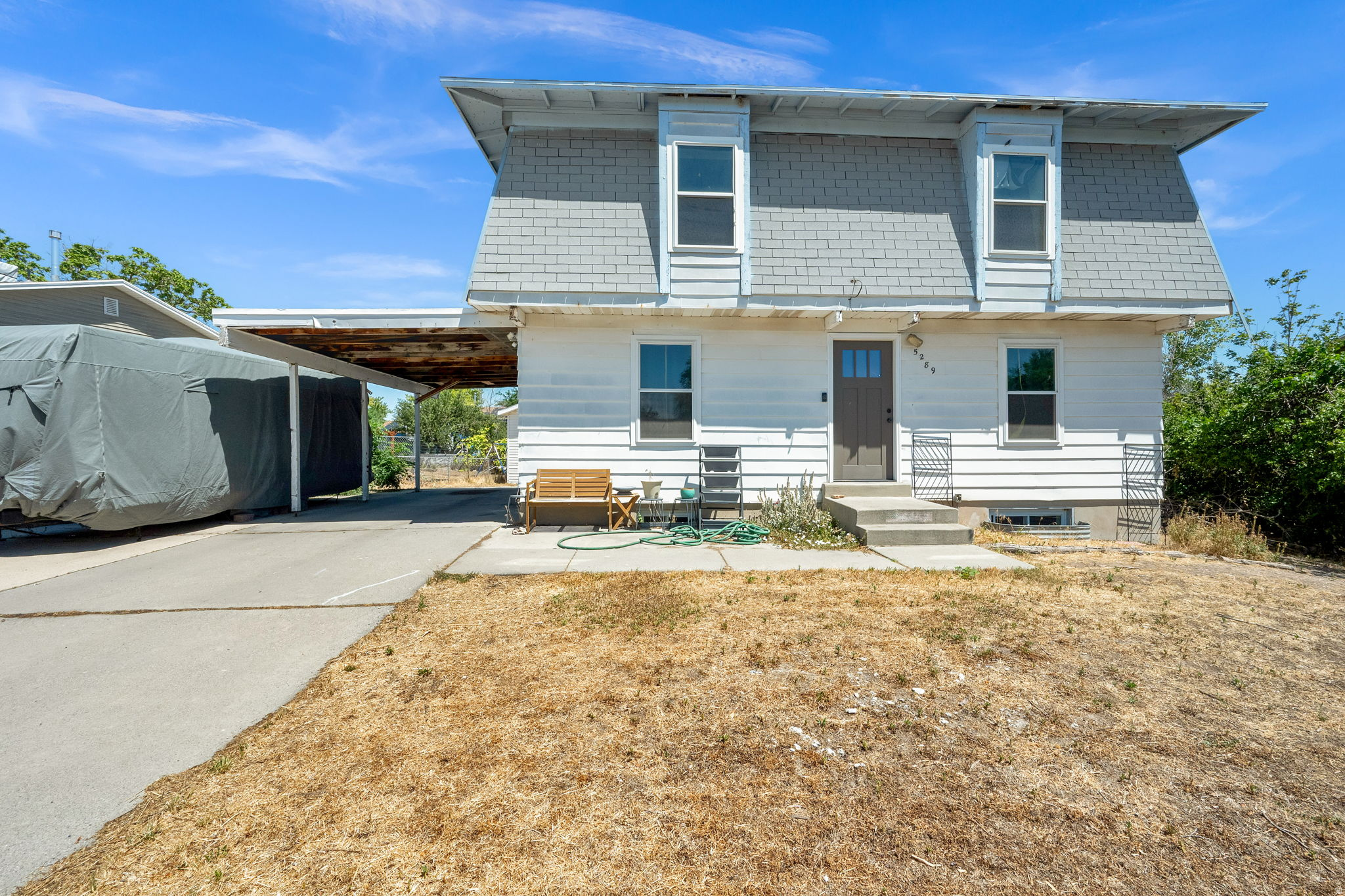 Rare opportunity to own 2,500 sq. ft. for under $500,000! This well-maintained 4-bedroom, 2-bath home in Kearns offers exceptional value with room to grow. Enjoy peace of mind with numerous recent updates, including new windows, bathtub and shower (2023), plus a new furnace, A/C, water heater, front and side doors, basement carpet, kitchen tile, garbage disposal, and oven (2025). The unfinished basement is already plumbed, offering endless potential to expand your living space and build equity. The detached garage provides the perfect space for a workshop, extra storage, or your favorite hobbies. Outside, you'll find fully fenced front and back yards, mature grapevines, and plenty of room to relax, play, or entertain. A fantastic opportunity for first-time buyers, growing families, or anyone looking for a move-in-ready home with incredible value! All information is provided as a courtesy only and was obtained from the previous MLS listing.