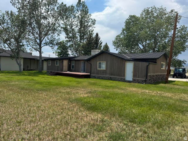 This place is very cute and cozy with a lake view.  Large lot with lots of tree's.  Large garage with 2 doors and cement floor.  This is a must see home located close to the lake wont last long.  Buyer to verify all information