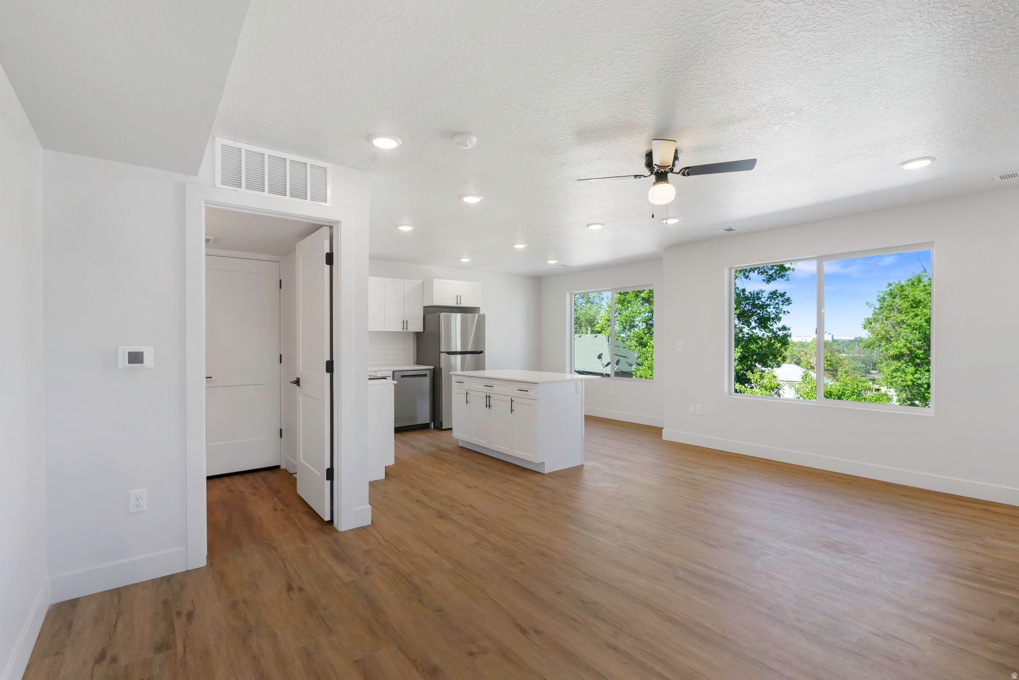 Tucked just off the street, Sycamore Townhomes offer a rare combination of peace, natural light, and a functional layout. This brand-new 2-bedroom home is designed for everyday living. The main floor features an open and airy layout. Upstairs, both bedrooms and the laundry are conveniently located together, making daily routines simple and efficient. Washer and dryer are included, adding immediate value and ease on move-in day. Natural light fills the home, highlighting clean finishes and durable laminate flooring throughout. This home includes a 2-car garage that is wired for an EV Charger and is positioned in a quieter setting away from main road traffic. Residents can also enjoy a shared grassy picnic area, perfect for relaxing or gathering. Conveniently located near the high school, restaurants, a grocery store, and a gas station, these townhomes offer both comfort and accessibility in one well-designed package. There are 7 townhomes available with 2 or 3 bedrooms. Contact Kim for more info.