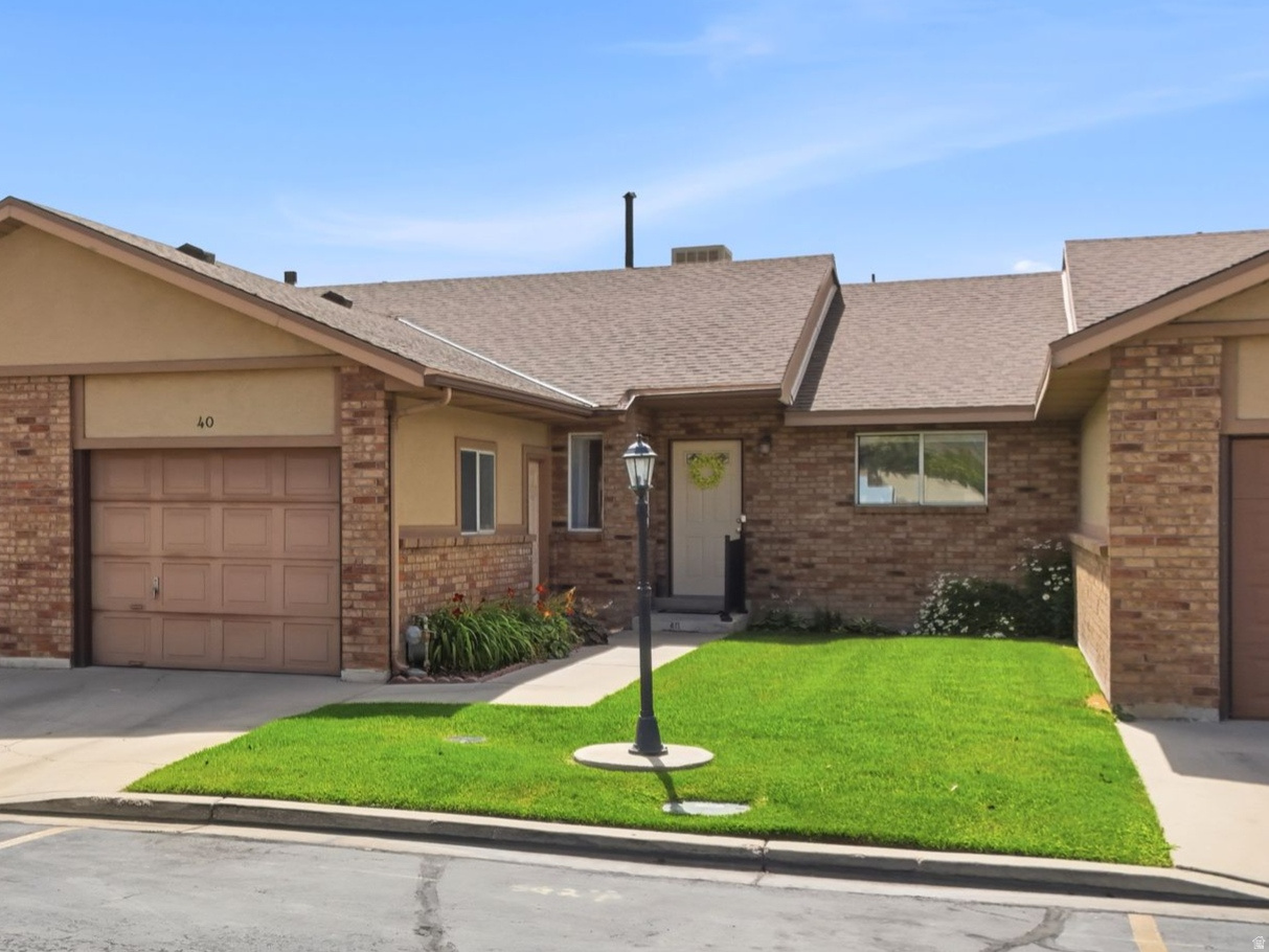 **OPEN HOUSE** Thursday 7/9/26 from 6PM-7PM & Saturday 7/11/26 from 10AM-11AM. This cozy ranch rambler is sure to surprise you! Enjoy main level living with three bedrooms, two bathrooms, and over 2,200 square feet. Incredible lake and mountain views from your private, fenced backyard while relaxing on your covered patio. Sneak a peek from your living room, and even your primary bedroom! This all brick condo has recently been refreshed and is ready for you! All appliances included. Home is in a trust with limited seller disclosures and is being sold AS-IS. Please allow 48 hours for all response times. All information deemed reliable but not guaranteed. Buyer to verify all.