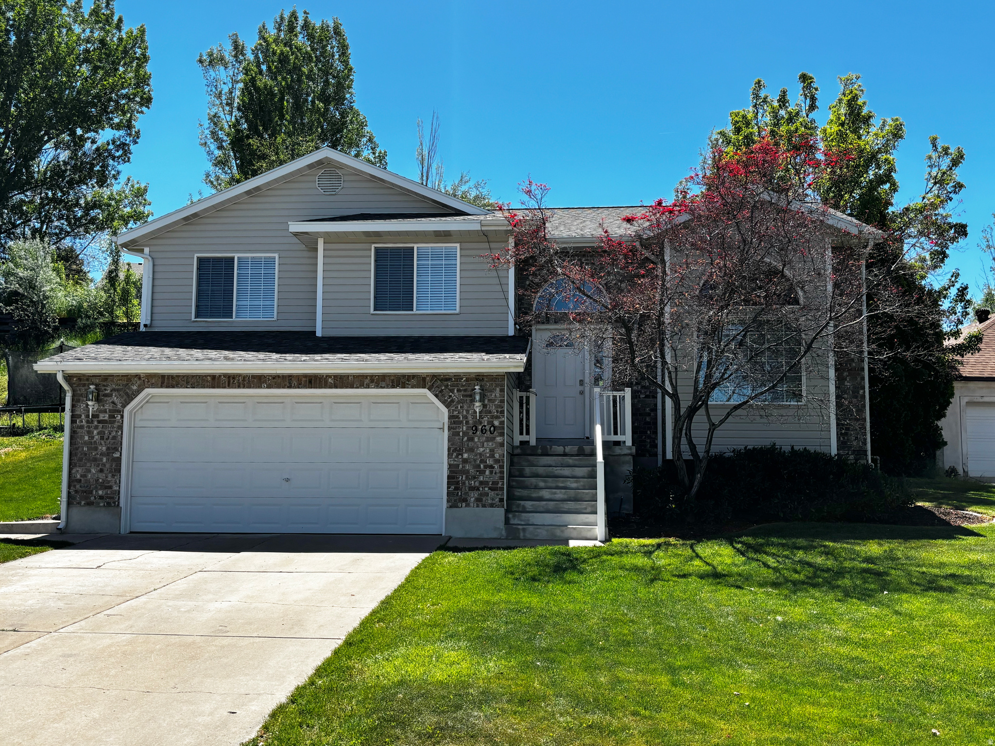 Price reduced for quick sale!!! Impressive East Layton Home!  New carpet and fresh paint, updated white kitchen, quartz countertops and newer stainless appliances. Roof replaced in the last 10 years, large bedrooms with walk in closets. Basement family room with fireplace and wet bar for entertaining. Beautiful private yard, nice garage. Great location and easy to show!