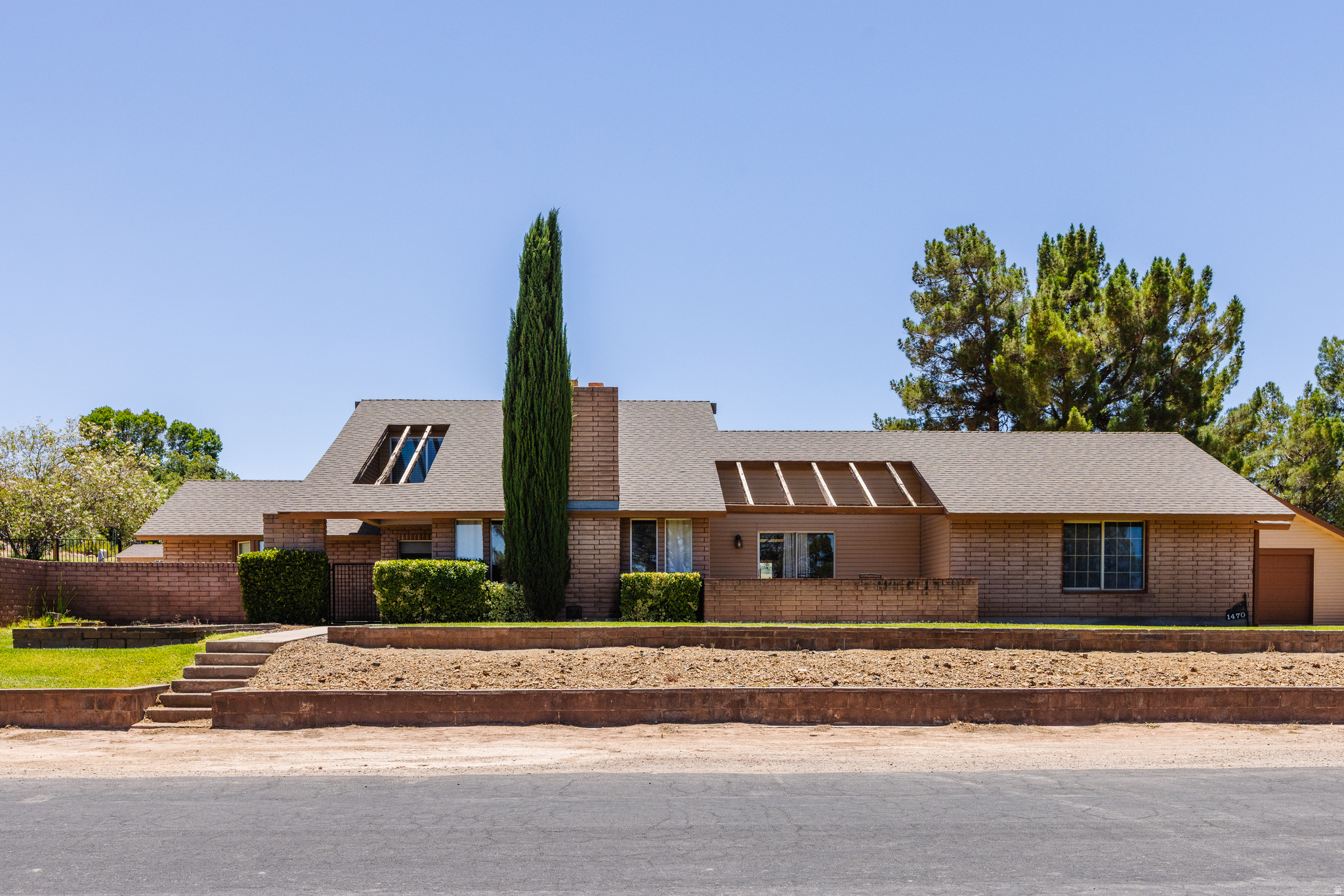 Welcome to this beautifully maintained 3-bedroom, 2.5-bath home offering over 3,400 square feet of comfortable living space in one of St. George's most desirable settings. Located in the heart of Bloomington Hills, this corner-lot property backs up to a golf course, giving you stunning views and a peaceful, resort-style backdrop right from your own yard. Step inside to find generous, light-filled living areas perfect for both everyday living and entertaining. The recently renovated master suite is a true highlight, offering a private, updated retreat to unwind after a long day. With 2.5 baths and ample square footage, there's plenty of room for family, guests, or a home office setup. Outside, enjoy your own private pool - ideal for beating the Southern Utah heat - surrounded by a well-manicured, thoughtfully maintained yard. The corner lot provides extra privacy and curb appeal, while the golf course adjacency adds a premium touch that's hard to find at this price point. Situated in a prime location close to shopping, dining, and everything St. George has to offer, this home combines comfort, style, and an unbeatable setting. Schedule your showing today!   Square footage figures are provided as a courtesy estimate only.  Buyer is advised to obtain an independent measurement.