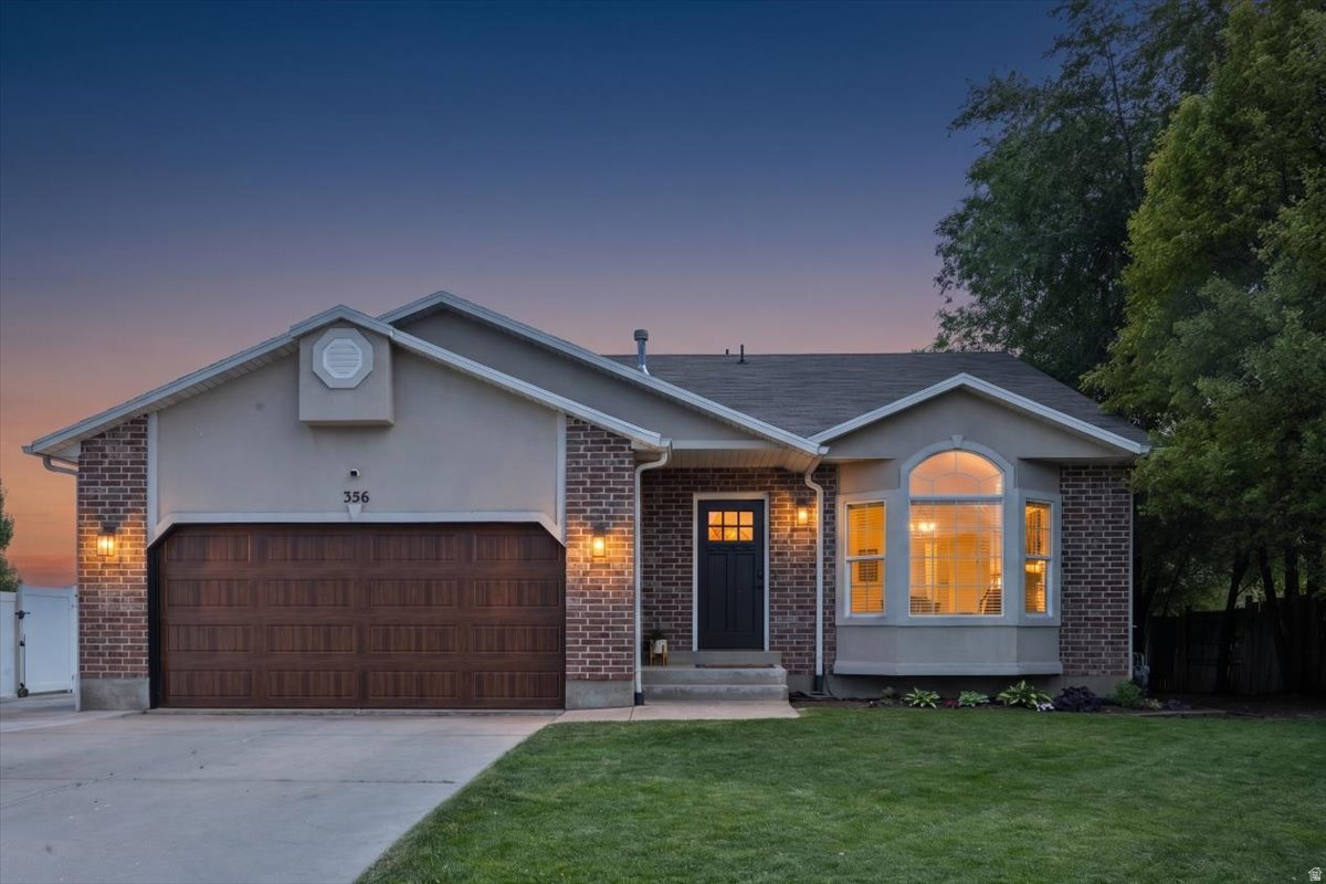 **OPEN HOUSE Saturday June 13th 11:00 AM  2:00 PM**   Welcome home to this beautifully updated tri-level retreat nestled in one of Layton's established neighborhoods. Thoughtfully renovated throughout, this home blends modern updates with comfortable living spaces designed for gathering, entertaining, and everyday life.  The heart of the home is the stunning remodeled kitchen, featuring updated cabinetry, countertops, appliances, and a spacious island that naturally brings everyone together. The open-concept main living area is filled with natural light and enhanced by modern finishes, updated lighting, and a cozy fireplace that creates a warm and inviting atmosphere year-round.  Upstairs, the spacious primary suite offers a peaceful retreat with recent updates including new flooring, fresh paint, and custom barn doors. The home's flexible tri-level layout provides multiple living spaces, including a large lower-level family room complete with a second fireplace and built-in speaker system-perfect for movie nights, game days, or hosting friends and family.  Step outside and discover one of the property's most impressive features: an expansive 98-foot RV parking area with plenty of room for recreational vehicles, trailers, toys, and additional parking. The private backyard is surrounded by mature trees that provide exceptional shade and privacy, while the updated deck and awning offer the perfect place to relax and enjoy beautiful mountain views. The space beneath the deck has even been prepared for a future patio or hot tub, creating endless possibilities for outdoor enjoyment.  With major updates already completed-including a remodeled kitchen, new furnace and A/C, sprinkler systems, garage door, front entry door, backyard improvements, and more-this home is truly move-in ready.  Conveniently located near schools, parks, shopping, dining, commuter routes, and outdoor recreation, this property offers the perfect combination of comfort, functionality, and lifestyle.