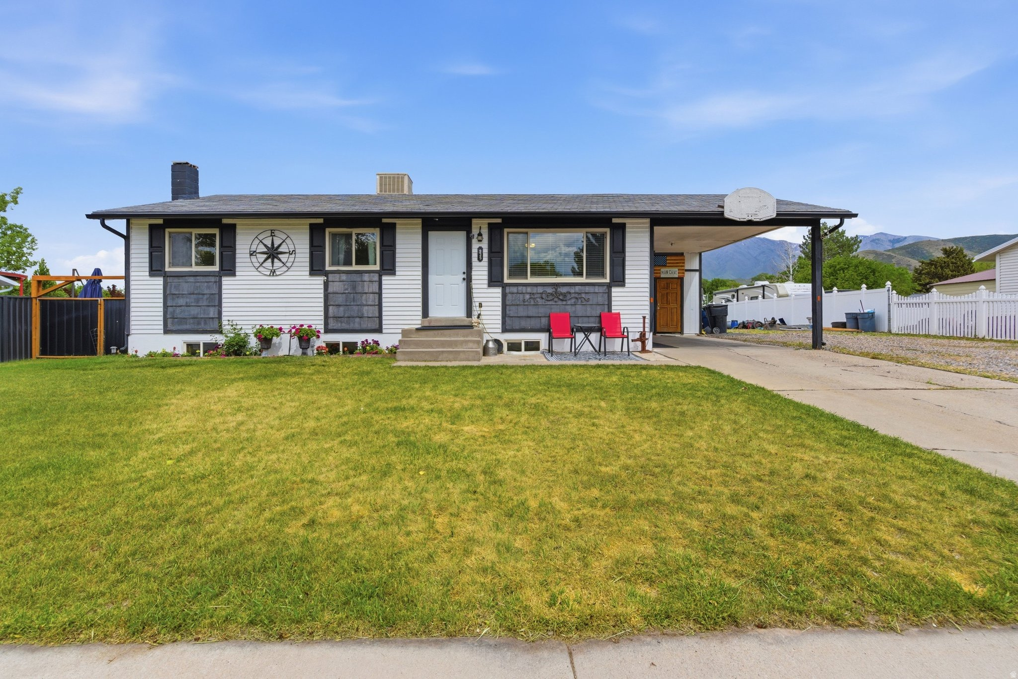New roof before closing! This charming 5-bed rambler sits on 0.24 acres with stunning mountain views, solar panels, and no HOA. Nearly complete basement remodel plus updates throughout - refreshed bathroom, new ceiling fans, and more. Carport, RV parking, and just 2 minutes to I-15. The backyard is a dream: expansive lawn, brick patio, raised garden beds, chicken coop, and storage sheds - all fully fenced. Whether you're entertaining or homesteading, this property delivers. Come see it before it's gone!  Square footage figures are provided as a courtesy estimate only and were obtained from county records. Buyer is advised to obtain an independent measurement.