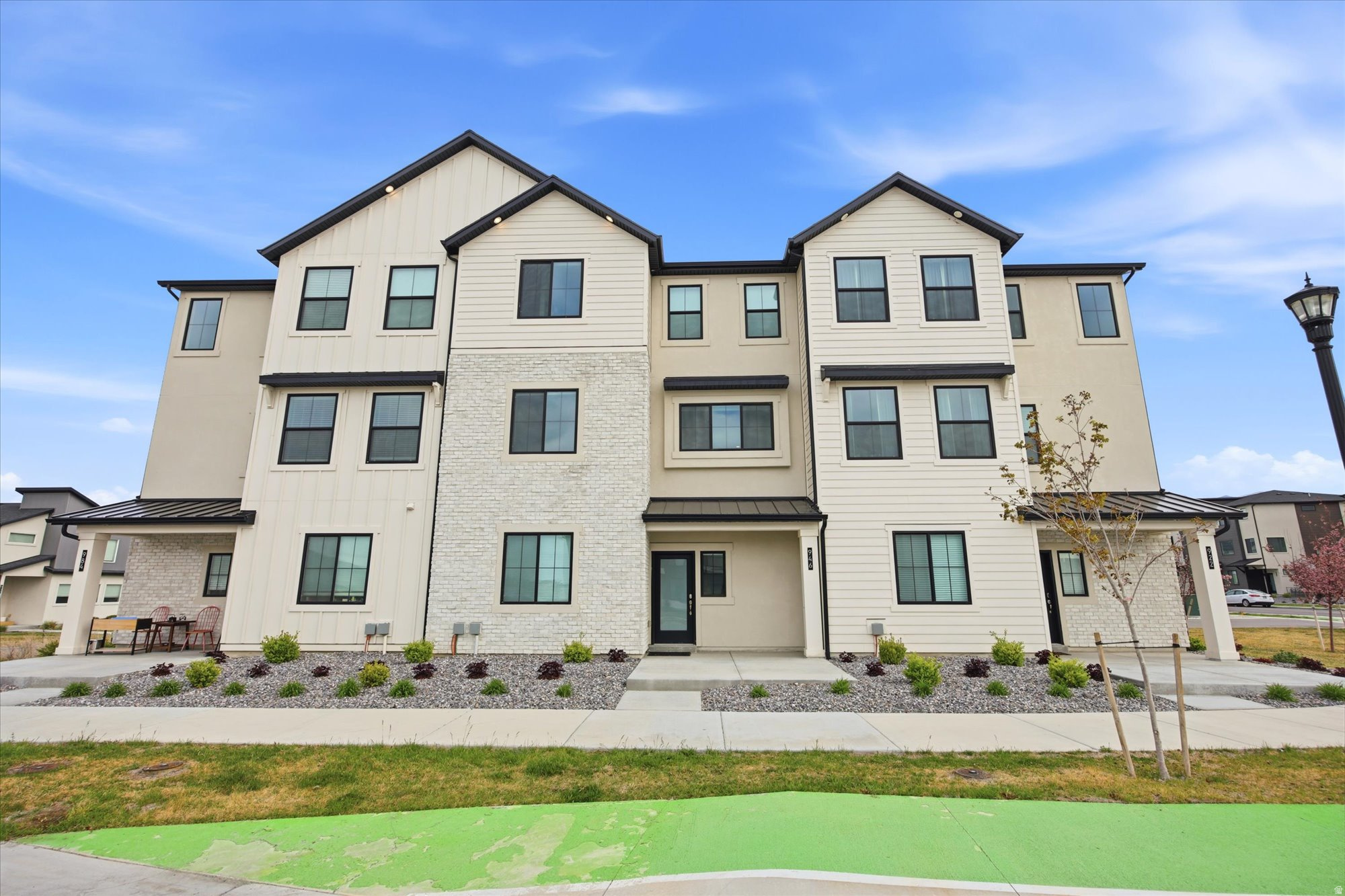 Welcome to this pristine, immaculately maintained townhome in the heart of American Fork, where thoughtful upgrades and modern comfort come together seamlessly. The open-concept layout is elevated by 9-foot ceilings, extended-height cabinetry, and a stunning custom high-end fireplace that anchors the main living space with warmth and style. Just off the kitchen, a versatile flex room with a window offers the perfect opportunity for a home office, guest space, or easily functions as an additional bedroom. Designed for both comfort and efficiency, the home features a 3-zone upgraded HVAC system for targeted climate control, a water softener, and upgraded electrical with 240V in the oversized 2-car garage-ideal for EV charging. Every detail has been carefully considered, creating a truly move-in-ready home in a highly desirable area close to shopping, dining, and continued growth throughout Utah County.