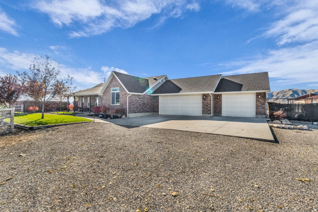 The home is fully remodeled in 2019 and beautifully finished, with a full mother-in-law apartment. Attached 3 car garage. Huge 32'x80' shop with air and heat with a 50'x50' barn attached with the possibility of being used as a business location. This property is being sold as potential commercial/industrial land. Zone changes happening on adjacent properties. UVU South campus is being built >1 mile. Maverick and commercial industrial complex recently built nearby. Currently in Ag protection, status will be released.  Seller is open to seller financing depending on the terms.