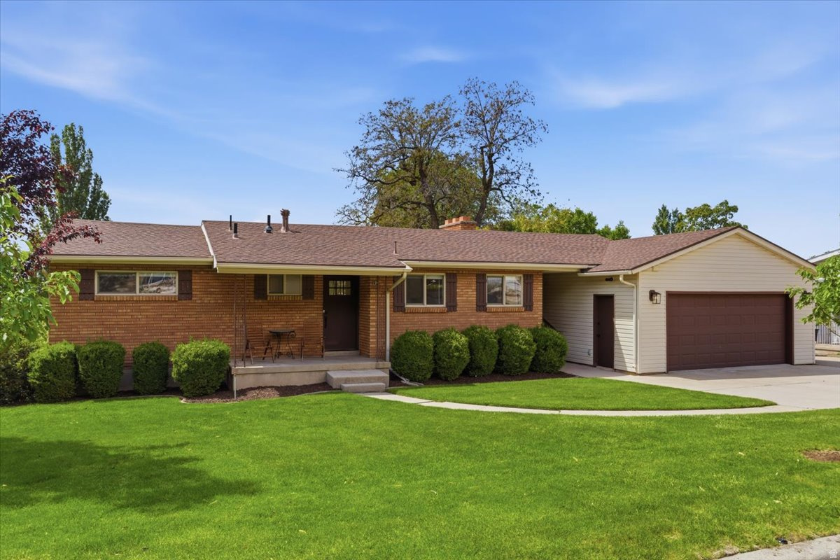 Charming 4 bedroom and 2 bath home in old town Farmington. This recently remodeled property features a brand-new kitchen with updated appliances, along with upgraded electrical and plumbing, fresh paint, and new flooring throughout.  Enjoy easy access to the mountains and nearby hiking trails, while still being just minutes from I-15 and the FrontRunner station. Nearby Farmington Station and Lagoon offer shopping, dining, and entertainment.  There's plenty of storage in the home, plus a 2-car garage with an attached workshop and an additional shed. The yard is fully landscaped with mature apple trees, newly planted trees along the street, and a spacious garden area.  Relax or entertain on the large deck where you can take in partial town sunset views.