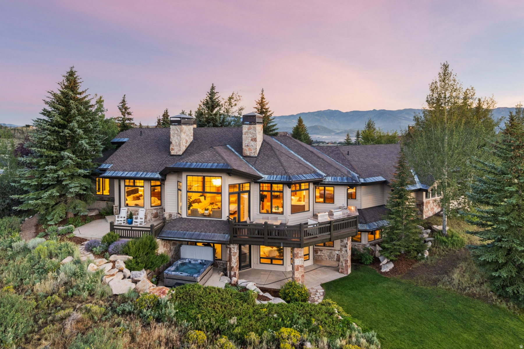 Golf Membership, luxury home, complete remodel, big views, ski,14th hole Dye golf.  A must see!   Full Golf Membership Available with this extensively remodeled 5,400 SF mountain modern residence, ideally positioned on the 14th fairway of the Pete Dye Course with sweeping ski mountain and golf course views. Offered fully furnished, this exceptional Promontory home blends timeless craftsmanship with sophisticated design and modern luxury.  Thoughtfully renovated throughout, the home features genuine White Oak hardwood floors, professionally refinished exposed timber beams, custom cabinetry, designer lighting, quartz countertops, and premium finishes at every turn. The chef's kitchen is equipped with a new professional-grade Viking appliance package, a redesigned custom butler's pantry, and a stunning wet bar with beverage refrigerator and built-in ice maker.  Designed for both everyday living and entertaining, the home offers4 spacious bedroom suites, 5 full baths, a powder bath, and a private upper-level office with fireplace and breathtaking mountain views. Expansive gathering spaces flow seamlessly to outdoor living areas featuring a custom outdoor kitchen, all surrounded by mature pine trees and beautifully landscaped grassy areas. Additional highlights include a heated oversized 3-car garage with epoxy flooring, custom storage, and a 48-inch Viking refrigerator; whole-home integrated audio, smart TVs, professionally installed security system with surveillance cameras, whole-home humidification, air conditioning, custom closet systems, and a 24 kW automatic backup generator.  Every detail has been thoughtfully curated to create an elegant mountain retreat offering exceptional comfort, privacy, and effortless luxury. A rare opportunity to own a truly turnkey Promontory home with outstanding views, impeccable renovations, and the coveted Full Golf Membership.