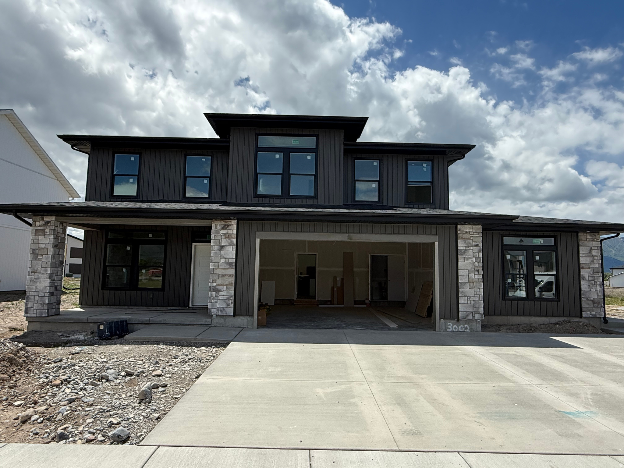 Brand new modern home finishing up June 5th! This home is stylish and functional with its attached ADU. Perfect for a rental, Airbnb, or family living with you. The main house is nothing short of incredible! Main level features LVP throughout, an office/den, living room, dining room, and a kitchen with tons of storage! The huge windows facing the Wellsville Mountains soak up the views and light. Upstairs are 4 large bedrooms, 2 full bathrooms, and a laundry room. The primary suite has mountain views, the biggest closet you've ever seen, dual vanities, a corner tub, walk in shower, and toilet room.  The Airbnb has matching finishes to the main house. This is a perfect house for those looking for an ADU! $10,000 towards closing costs when using a preferred lender. 1-year limited warranty included from the builder.