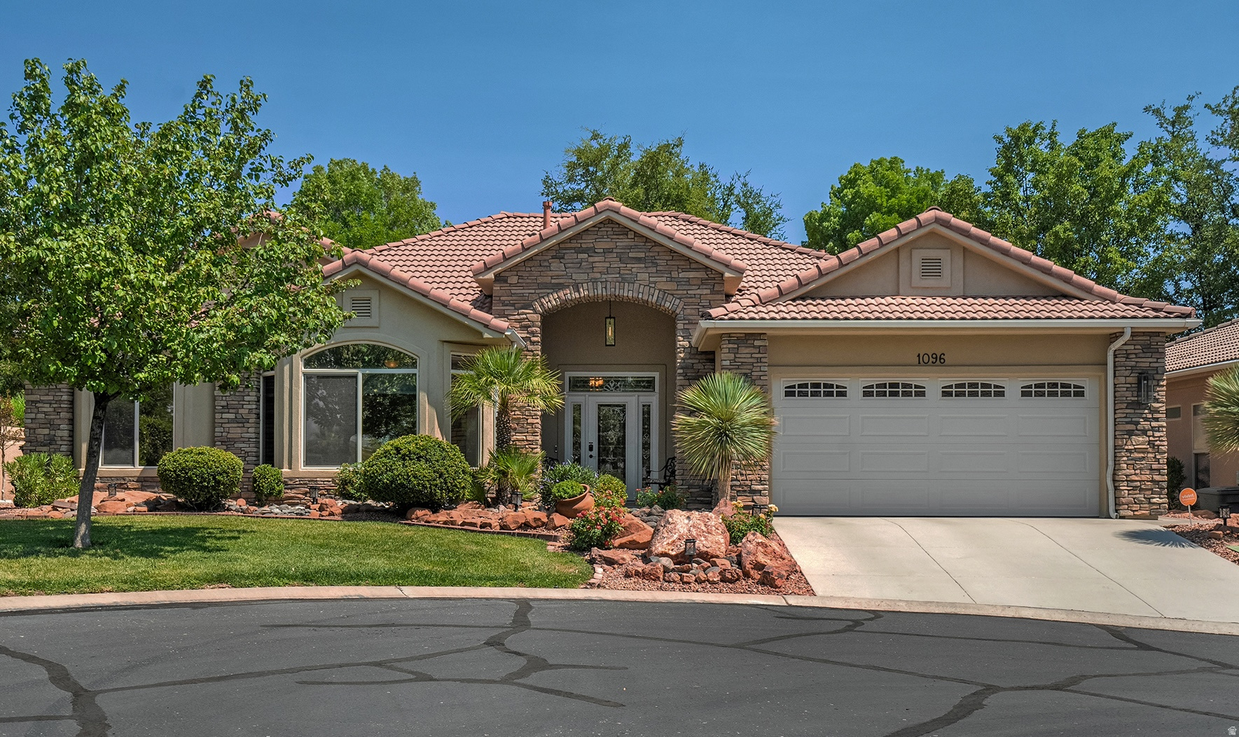 Rare opportunity in Green Springs! Located in a gated community steps from the golf course and HOA amenities, this beautifully updated home offers an unmatched indoor-outdoor lifestyle. The heart of the home is the sunlit great room, anchored by a gorgeous stone fireplace and a dramatic wall of French doors and transom windows showcasing serene views of lush green grass and a winding pond/stream. The kitchen is fully upgraded with floor-to-ceiling solid white oak cabinets, soft-close drawers, granite tops, and a double-oven gas stove. Out back, it is designed to provide cool shade in the morning and evening. The outdoor space features an expansive paverstone patio with tongue and groove pine board covered patio, flame lantern lights,a view of the local red hills, and a gas BBQ hookup--perfect for entertaining. Inside, luxury details abound: crown molding, skylights in both bathrooms, a smart thermostat, and a primary suite with a custom closet, jetted tub, and bidet. The second bedroom features a sleek Murphy bed, maximizing your square footage. With the fridge, washer, dryer, bedroom TVs, and garage cabinetry all included, this beautiful gem is ready for you to move right in!