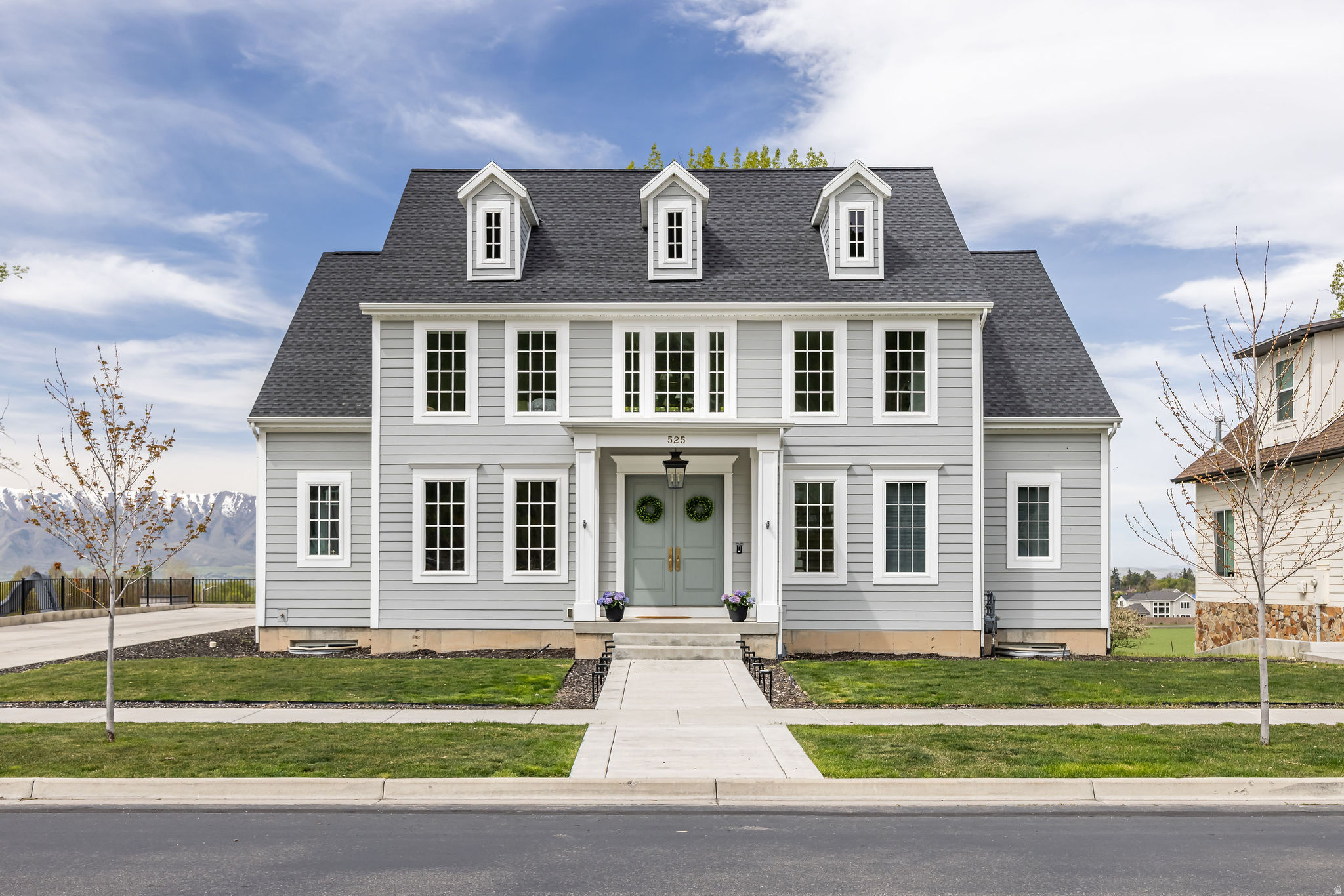 Located in the Providence Shire community, this professionally designed custom residence offers refined living with exceptional attention to detail and thoughtful architectural flow.  The main level is defined by expansive, light-filled spaces and a cohesive open-concept design that connects kitchen, dining, and living areas. At the center, a chef's kitchen features a statement Hallman range, a generous butler's pantry, and elevated finishes carried consistently throughout the home.  Designed for both function and flexibility, the residence includes three washer and dryer hookups, multiple utility zones, and two fireplaces that enhance both comfort and architectural character. The layout reflects intentional planning, supporting both everyday living and elevated entertaining.  Finishes throughout are curated and cohesive, showcasing exceptional craftsmanship and a level of detail rarely found in new construction.  Buyer to verify all information.