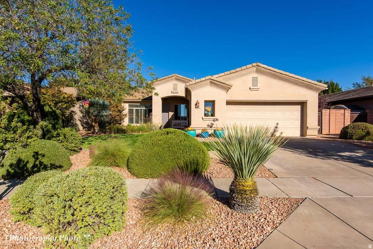 Welcome to this lovely 4-bedroom, 2-bathroom home in Coral Canyon. Inside, you'll find a functional floor plan designed for comfortable everyday living, with inviting living spaces and plenty of natural light throughout. The backyard is designed for both relaxation and enjoyment, complete with a covered patio and a variety of mature fruit trees. The garden box is plumbed with a drip system, plus a trellis system supports 18 grapevines! Centrally located, this home is near freeway access and minutes from scenic paved trails, mountain biking paths, and the community clubhouse featuring a fitness center, indoor and outdoor pools, tennis courts, and pickleball courts.