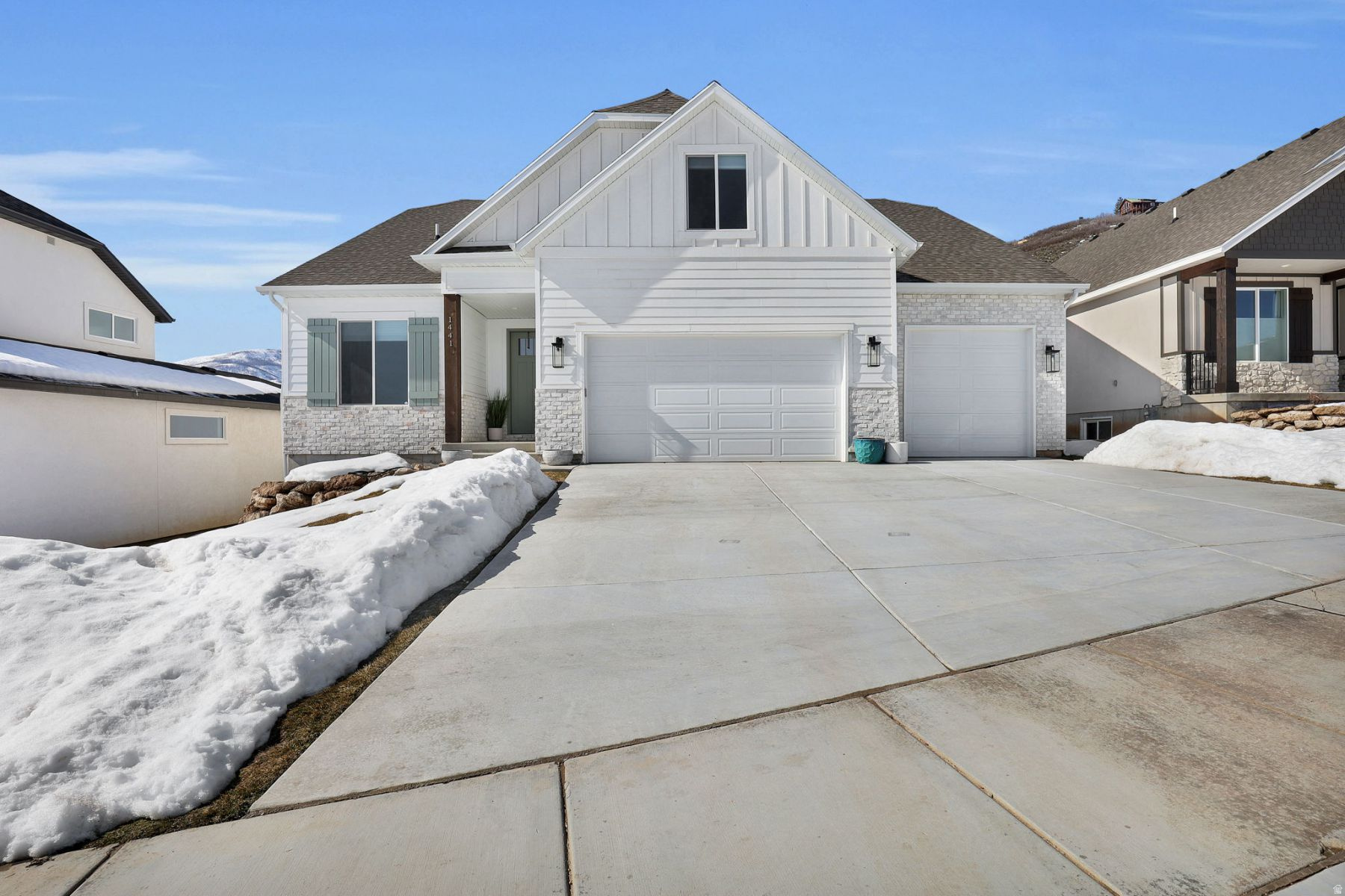 Welcome to this stunning, light-filled modern home in the highly desirable Scotch Fields subdivision. Completed in 2023, this thoughtfully upgraded residence offers seven spacious bedrooms and four beautifully appointed bathrooms, all designed to balance modern style with everyday comfort-plus spectacular panoramic views of the Wasatch Mountains.  The home makes an immediate impression with an oversized main-level primary suite that feels like a true retreat. The central living area features soaring lofted ceilings that create an open, airy atmosphere perfect for both relaxing and entertaining. During construction, the fireplace was strategically relocated to an interior wall, opening the entire back of the home to the views. A dramatic 10' x 6' picture window perfectly frames the ever-changing mountain backdrop.  Function meets lifestyle throughout. The three-car garage includes an extra-long 40-foot bay-ideal for vehicles, toys, and outdoor gear. Inside, enjoy a generously expanded mudroom, luxury vinyl plank flooring throughout most of the home, extra-large tile in the primary and front bathrooms, upgraded tile and countertops, and stylish modern fixtures that elevate the space without feeling overdone.  Located in Scotch Fields, this home offers direct access to the Midway trail system and Wasatch State Park for year-round hiking and biking. World-class skiing in Historic Park City is just 15 minutes away, with the new Deer Valley East Base Area only 10 minutes from your door. Fly fishing, golf, and endless outdoor recreation are all close by.  Modern, welcoming, and perfectly positioned-this home delivers the mountain lifestyle you've been looking for. Schedule your private showing today.  Home was staged for photos and is no longer staged.