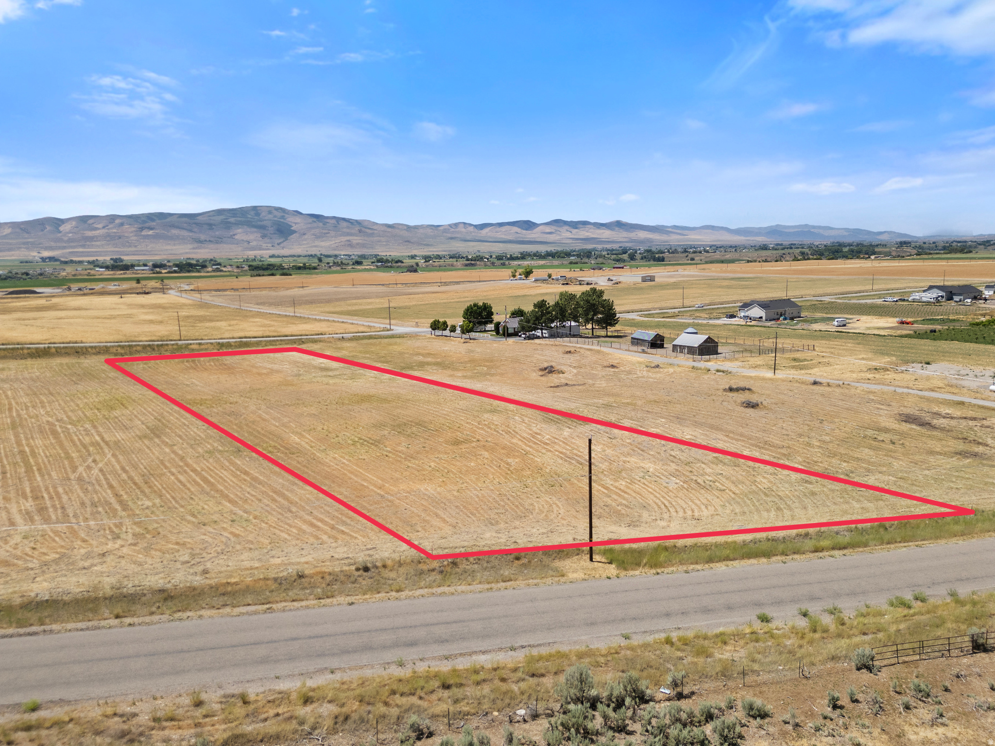 Discover the perfect blend of country living and endless possibility with this beautiful 2-acre parcel nestled among the peaceful rolling hills of Collinston, UT. Enjoy the tranquility of wide-open spaces with scenic views of Tremonton and Bear River.  Whether you're envisioning a custom single-family home, dry-farming, or for large animal use, this versatile lot offers the flexibility to bring your dreams to life. You can utilize your own builder or use our custom home builder. Just a short 10 minutes to Tremonton and Crystal hot springs in Honeyville. Also, a quick 25 minute drive to Utah State University in Logan and 40 Minutes to Ogden with easy access to I-15.   Power is available on the front of the lot. The Perk test has been done and is good to go! It has Bear River Culinary water. The unobstructed sunsets with beautiful valley and mountain views makes this parcel a stand-out!