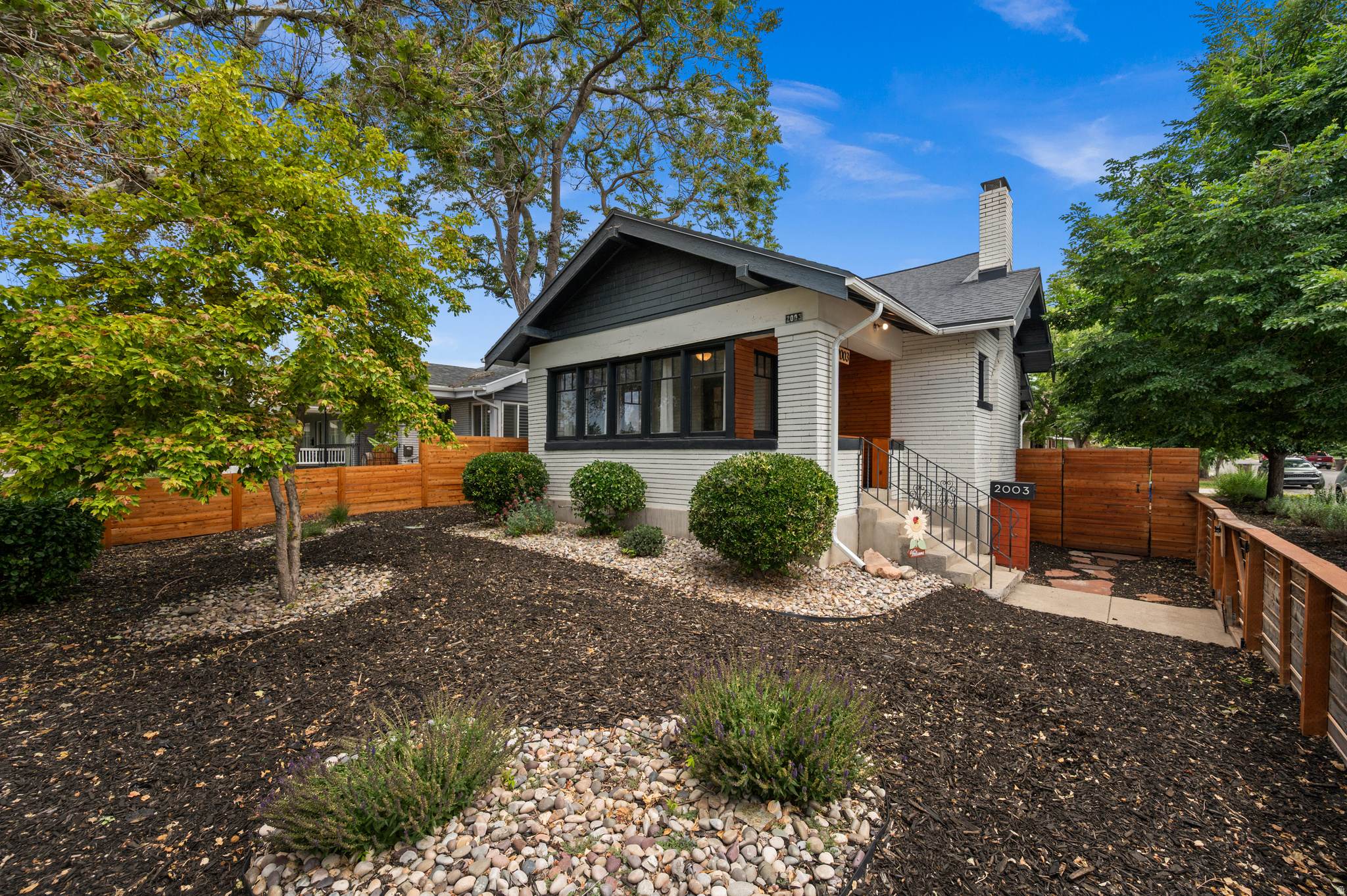 This classic Sugarhouse bungalow is teeming with timeless character.  You'll find all of the favored Craftsman Style attributes coupled with the bonus of modern day livability.  The large, enclosed porch offers endless possibilities for use, from mud room to yoga den to tea grotto and more!  Open and interactive, the living area flows seamlessly into dining and ultimately into the sweet surprise of the beautifully renovated kitchen.  Natural light pours in allowing the wood floors to gleam throughout the day as the sun moves across the southeastern sky.  There's one large front bedroom with jack n' jill access to the bathroom. A second, even larger bedroom attaches to a space perfect for a nursery or full dressing room/walk-in closet--practically three bedrooms on the main floor!  Also on the main and a such a gift for this neighborhood, is the designated laundry room.  No trekking up and down stairs with the laundry basket.  The second story bedroom is huge with an attached bathroom, all perfectly temperature controlled with a brand new mini split heat pump.   As you walk out the back door you will be greeted with more of the unexpected!  You'll immediately notice the beautifully crafted sauna for those chilly afternoon apre ski days.  A few steps further and voila....your home office and/or gym attached directly to the new oversized one car garage.  Square footage of the accessory unit is noted in the listing as the 3rd floor.  This room is also fully temperature controlled with a mini split heat pump.  All of this and a newer roof and currently unfinished basement for storage you never imagined.  Location, charm and livability doesn't get any better!