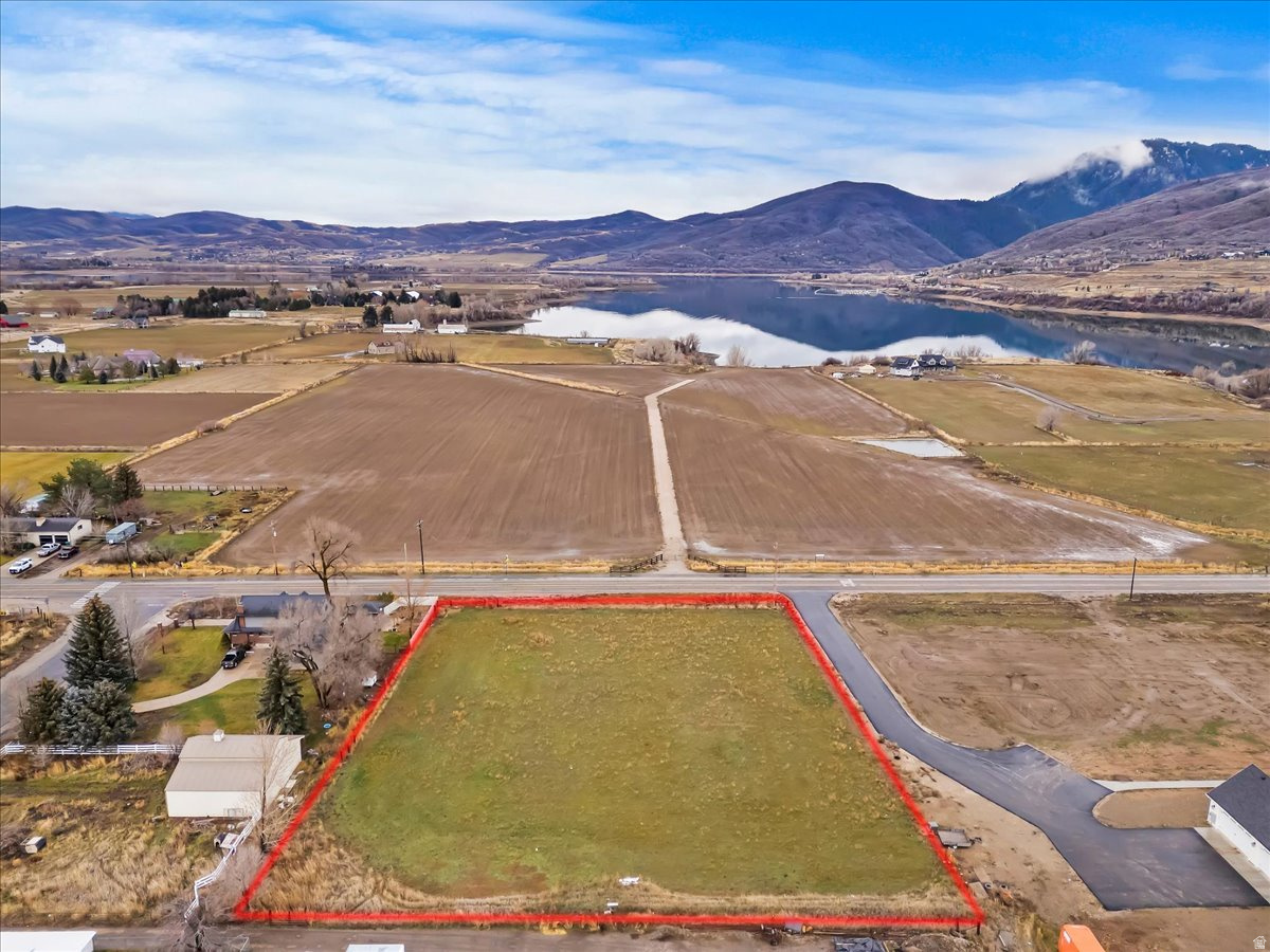 Rare Opportunity in Beautiful Ogden Valley!  Build your dream home on this exceptional 1.76-acre lot in one of Ogden Valley's most desirable locations. Zoned AV-3, the property allows for agricultural and single-family residential uses, offering flexibility for a variety of lifestyle possibilities. The land includes owned water shares and is approved as a horse property, making it ideal for those seeking space, privacy, and rural charm. Enjoy stunning mountain views in every direction and easy access to world-class, year-round recreation, including renowned ski resorts, hiking, biking, boating, fishing, and more-all just minutes away. Construction-ready properties like this are increasingly rare in Ogden Valley, especially at this size and price point. Don't miss this unique opportunity to own a premium piece of Ogden Valley!