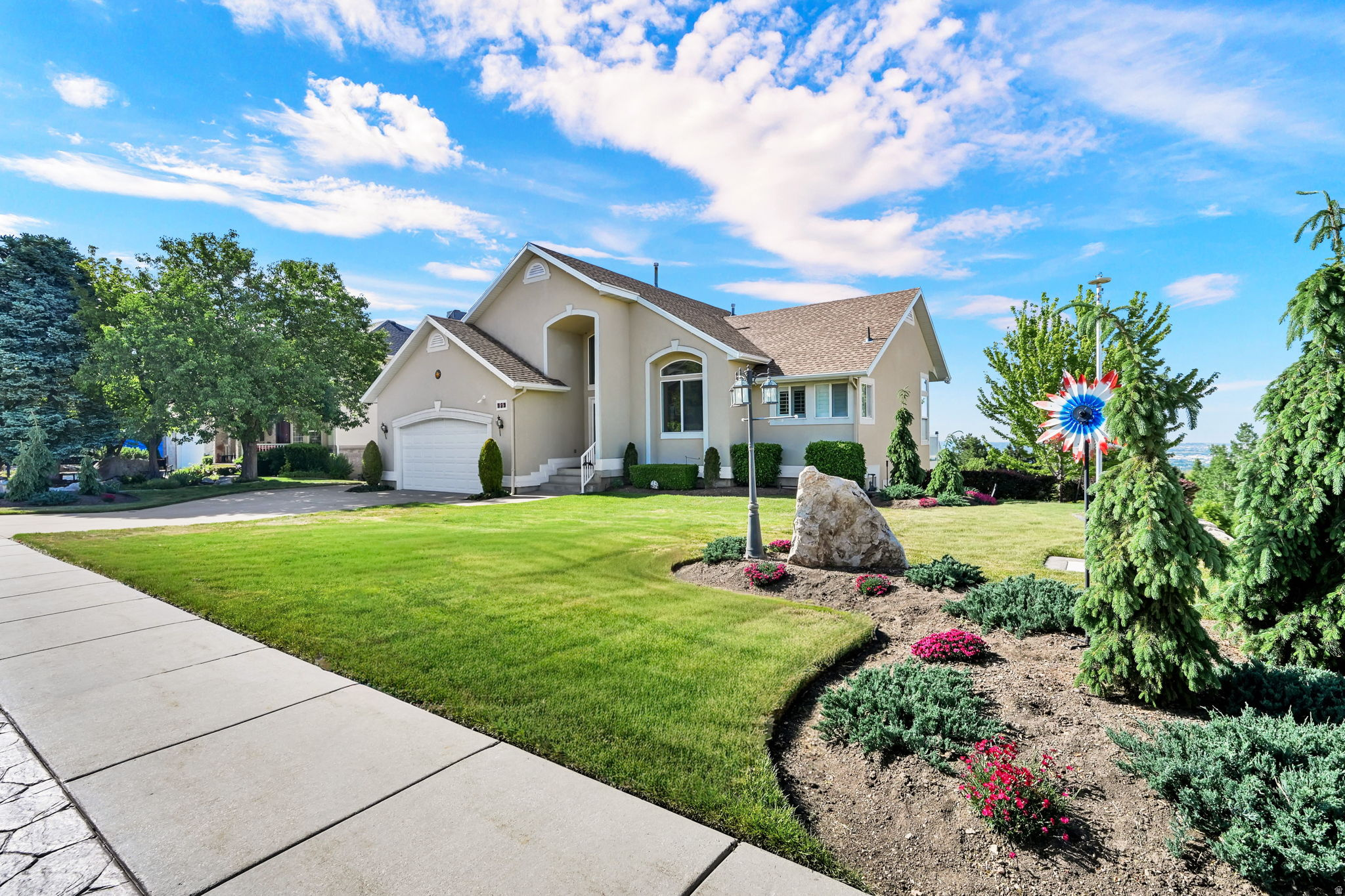 Perfectly positioned on the scenic mountains of North Ogden, this beautifully maintained 3,162 sq ft home offers the kind of views you never get tired of - mountains in one direction, valley lights in the other, with large windows that make the most of both. A beautiful deck overlooks panoramic mountain and valley views, creating the perfect place to relax, entertain, or enjoy Utah's changing seasons.  With all essential living spaces conveniently located on the main level, the home offers comfortable everyday living along with the added flexibility of a spacious walk-out basement. Inside, you'll find 6 bedrooms, 3 bathrooms, generous living areas, and new carpet and paint that gives the home a fresh, updated feel.  Outside, the yard is filled with mature plum, apple, and peach trees, along with plenty of garden space to enjoy throughout the seasons. A newer roof adds peace of mind, while the 2-car garage and convenient location near schools, shopping, trails, and commuter routes make everyday living easy.  If you've been looking for space, views, and a quieter setting without feeling far from town, this North Ogden property is one worth seeing.