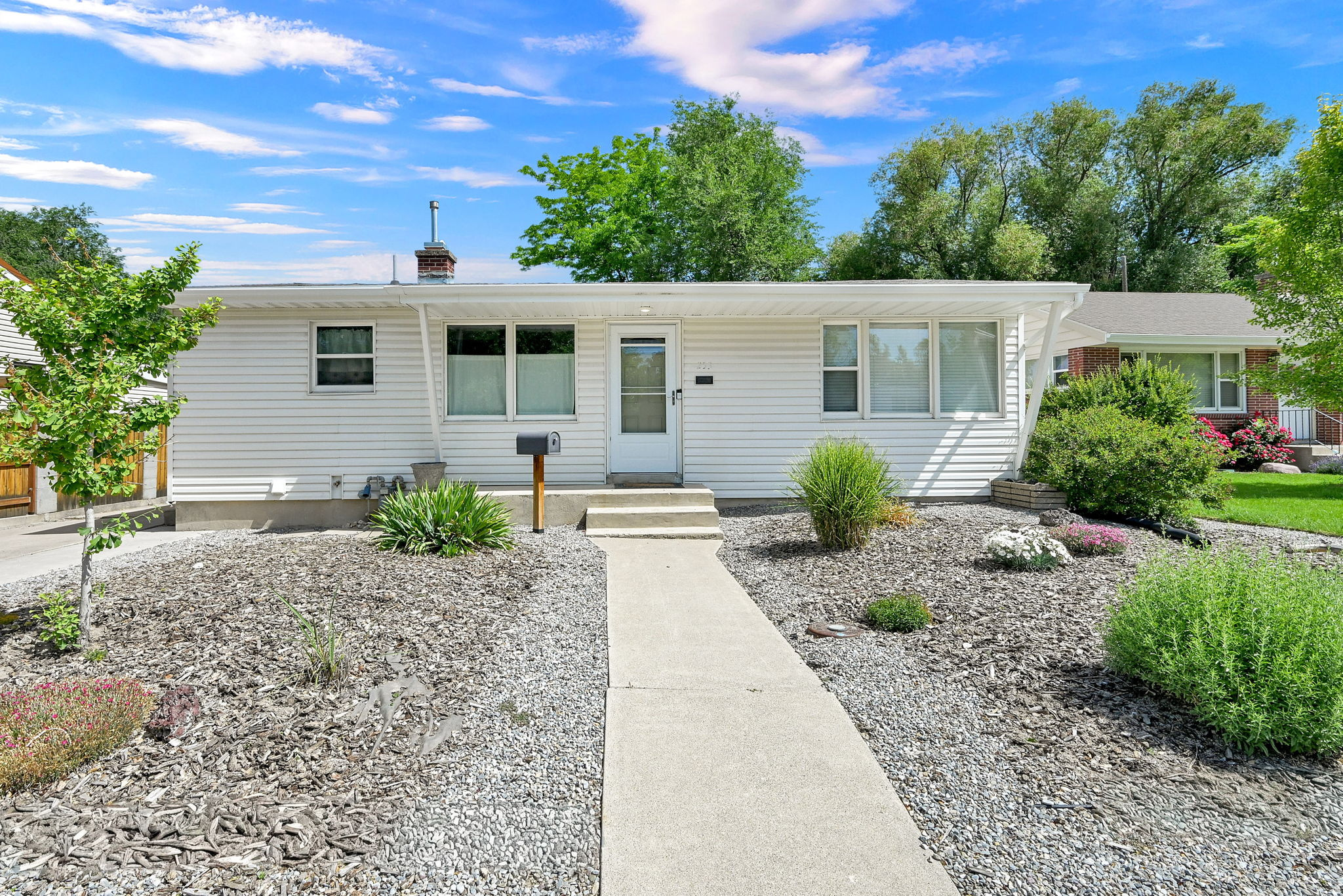 Tucked into a cul-de-sac in the Adams neighborhood, this 4 bed/ 2 bath,1950's rambler couldn't be situated more perfectly to give you all that Logan has to offer. Only 2 blocks from the transit center, you'll have unfettered access to the university bus routes, downtown and Logan's cultural arts community. Location aside, this house has all the charm to make this house your home. Boasting original oak hardwood floors, a newer AC, vinyl siding, updated windows, mature zeroscape landscaping, storage, an office in the back of the storage space downstairs and a 4th bedroom with a walk in closet that could be used as a living  room. Let's schedule a time to look at the house and get you on your way to living in the heart of Cache Valley by making this home yours.  Buyer to verify all.