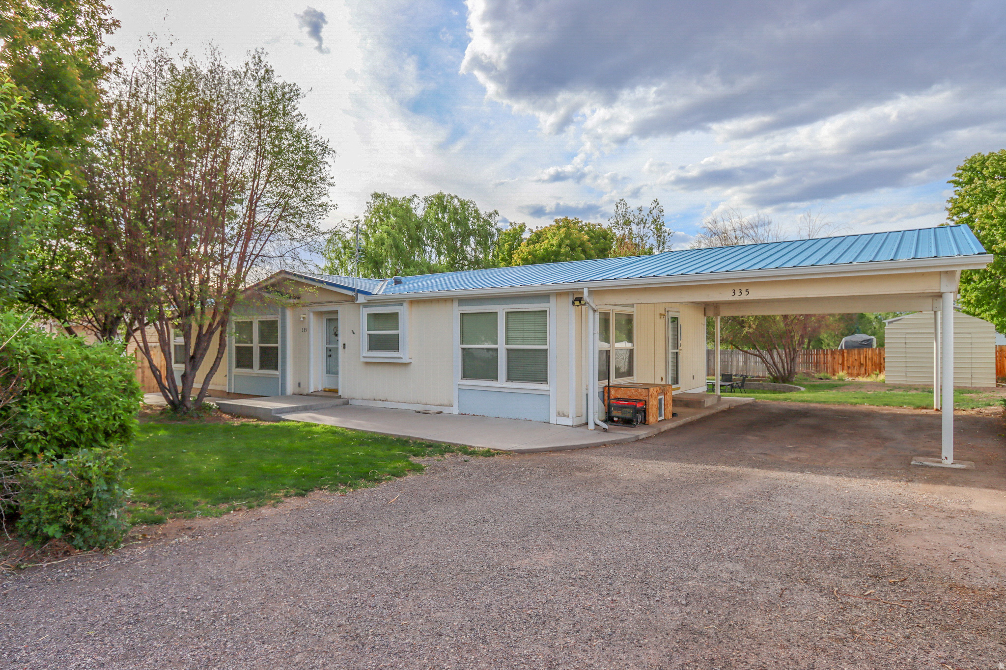 Lovely, move-in-ready, and well-maintained home. New kitchen flooring and countertops. South Sevier Middle School's soccer field and track sits across the street. The home is also located only a block away from a hot springs resort. This could be a draw for short term rentals with city approval. Quiet neighborhood with better privacy and views thanks to no across-the-street neighbors. Peaceful yard with landscaping, garden boxes, two large sheds, and beautiful trees. Functional, attractive home!