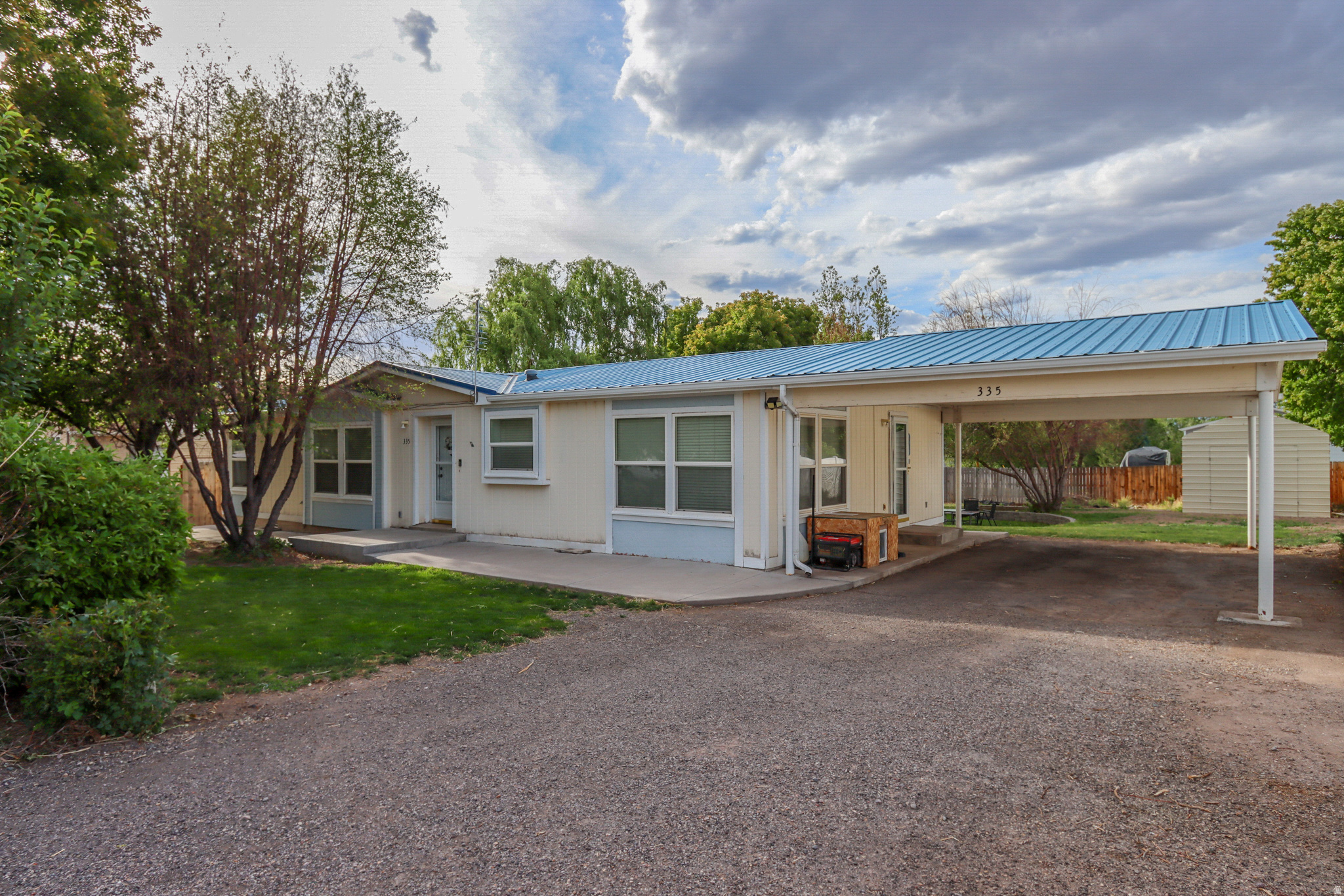 Lovely, move-in-ready, and well-maintained home. New kitchen flooring and countertops. South Sevier Middle School's soccer field and track sits across the street. The home is also located only a block away from a hot springs resort. This could be a draw for short term rentals with city approval. Quiet neighborhood with better privacy and views thanks to no across-the-street neighbors. Peaceful yard with landscaping, garden boxes, two large sheds, and beautiful trees. Functional, attractive home!