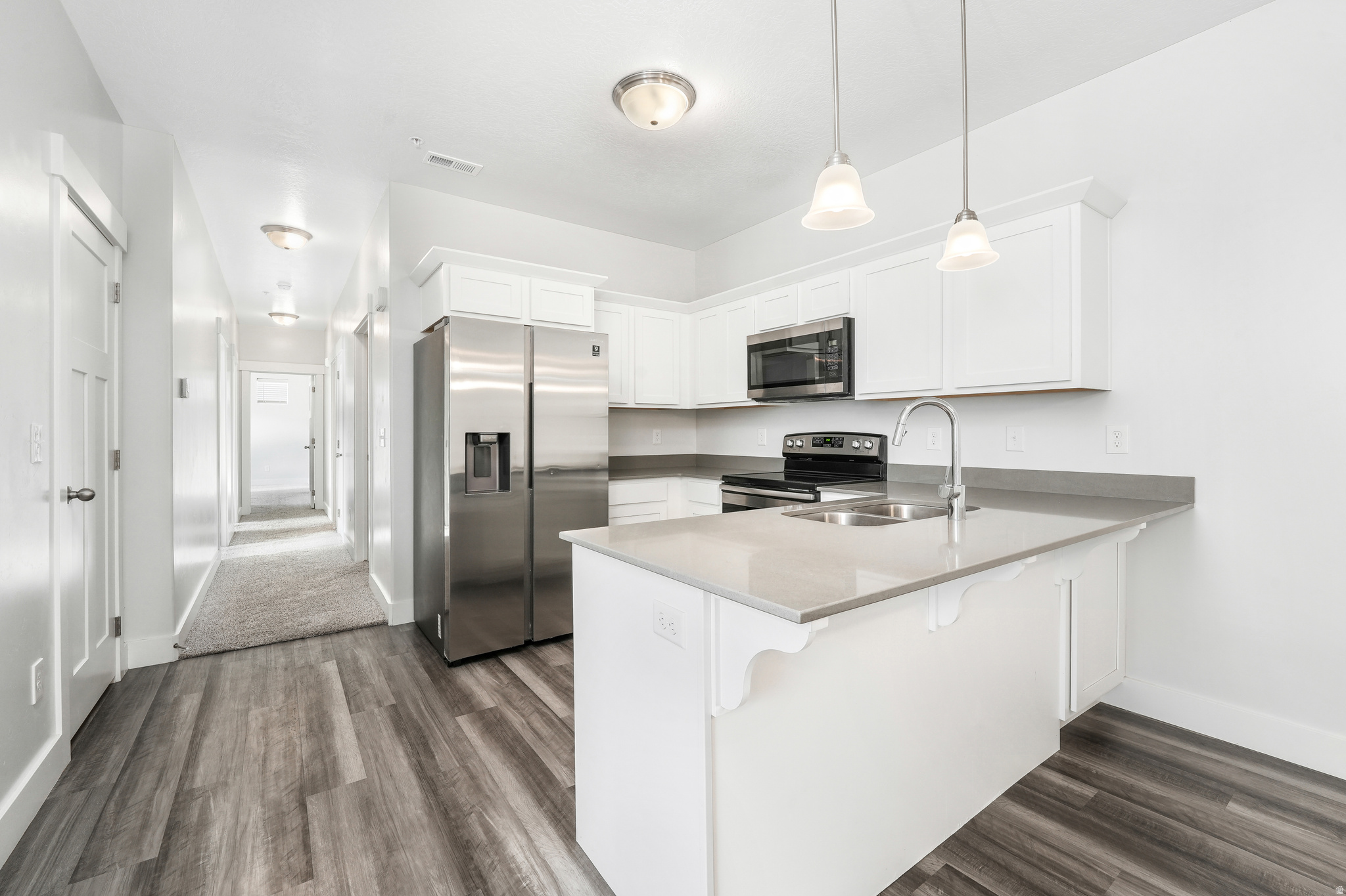 Move-in ready and beautifully maintained, this 3-bedroom, 2-bathroom Edge Homes condo offers modern finishes, an open-concept layout, and everything you need to settle in from day one. All appliances are included, along with window coverings throughout, making this a truly turnkey home. The bright kitchen flows seamlessly into the dining and living areas, creating a comfortable space for everyday living and entertaining. The spacious primary suite features an en-suite bathroom and generous closet space, while two additional bedrooms offer flexibility to fit your needs. Skip the added expense of purchasing appliances and window coverings-everything is already in place so you can move in and start enjoying your new home from day one. Enjoy low-maintenance living with access to incredible community amenities, including a pool, clubhouse, fitness center, pickleball courts, playgrounds, and walking trails. Conveniently located near Utah Lake, shopping, dining, entertainment, UVU, BYU, FrontRunner, and I-15, you'll have easy access to everything Utah County has to offer. Whether you're looking to purchase your first home, expand your investment portfolio, or simply enjoy a low-maintenance lifestyle, this home offers exceptional value in one of Vineyard's most desirable communities. Square footage figures are provided as a courtesy estimate only and were obtained from county.  Buyer is advised to obtain an independent measurement.