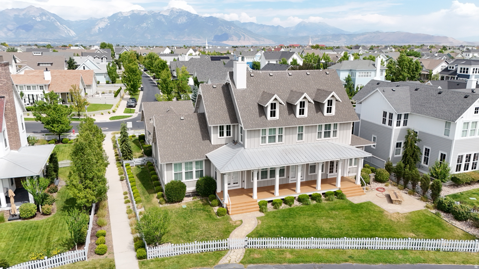 "Welcome Home" to a Daybreak estate unlike any other: a private home cinema, a private spa with steam shower and sauna and an entire block of little shops, all beneath a residence that sits front-row to Oquirrh Lake, with unobstructed water views and the beach path just steps behind the home. Set on a large .28-acre lot with picturesque views of the lake and the Wasatch Range where every nook and cranny has been thoughtfully upgraded. From the moment you enter it's clear nothing was left to chance. The Main Level is built for easy living: a Primary Suite that frames the views and opens to a fully upgraded bath with new cabinetry, flooring, double lavs, walk-in shower, stand-alone soaking tub and generous closet space; a spacious guest room with ensuite bath and lake/mountain views of its own; a third bedroom/office/den with custom paint and raised paneled woodwork; a large laundry room; and a full-length covered porch to take in views during rain, snow or shine. The remodeled kitchen anchors the home with all new custom cabinetry and new stainless steel appliances around a huge Taj Mahal leather quartzite island with a 72" double refer/freezer, 30" double ovens, built-in microwave and 36" cooktop with pot filler. The Upstairs delivers the showstopper with two rooms converted into one supersized fairytale bedroom with lake/mountain views, four (4) built-in bunk beds with matching under-bed drawers and individual reading lights, an ensuite bath and double walk-in closets, plus, another large ensuite bedroom, a second laundry room and a built-in study area. Then the Lower Level makes good on the opening promise: The Spa room: full-size steam shower, sauna and bathroom facilities. The Safe room: w/full-size vault door and fire-protected storage. The Stage room: for the performer in you. The Theater room: with 135" screen, high-end Sony projector with surround sound and tiered seating. The Exercise/Dance room: a mirrored workout/dance studio that could also be a sixth bedroom. And finally...Welcome to: 5 Pretend City Lane: a Cafe' with register, pastry displays and outdoor seating; a Pet shop, a Grocery Store and a two-story playhouse with its own living area, fireplace, stairs, balcony and slide. All of it in beautiful Daybreak, one of Utah's most celebrated communities designed around Oquirrh Lake, miles of trails and the new Downtown Daybreak/Salt Lake Bee's stadium, just beyond your porch. A true generational home! Come See it, Love it and Make it your own!!
