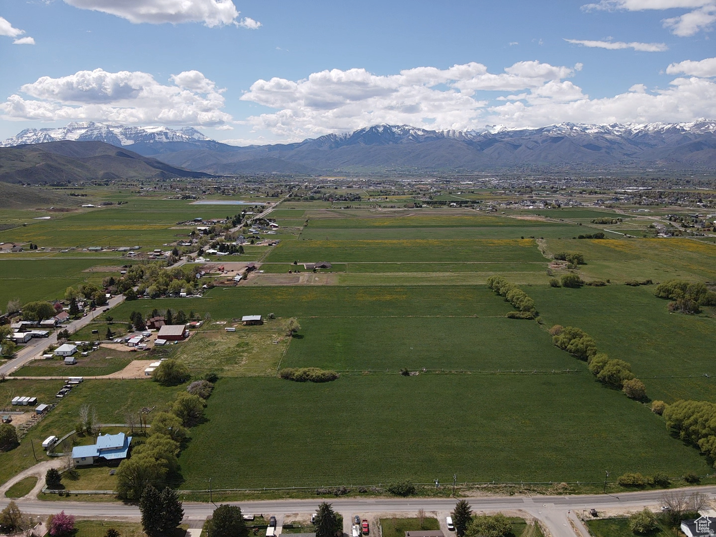 Welcome to this wonderful 4.8-acre property in the highly desirable and rapidly growing Center Creek area of Heber City! This rare piece of land offers flat, fully usable acreage. With direct access from the main road and potential for rear access, it offers excellent flexibility for future development. The property is fully fenced for privacy and security, with stunning mountain views all around.