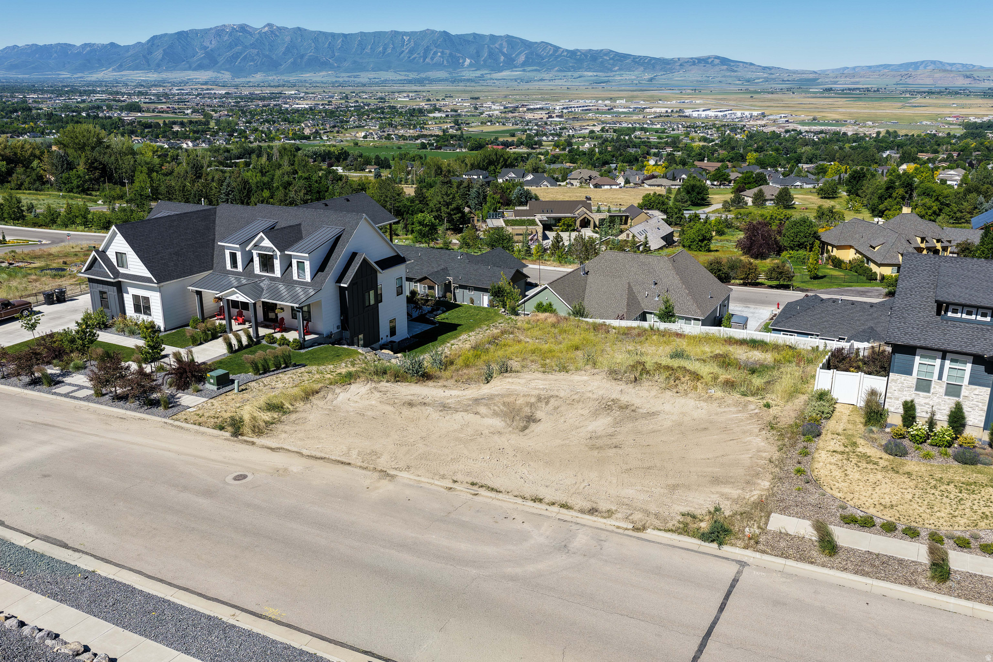 Stunning lot taking in impressive mountain and valley views. One of only a couple lots not built on in the prestigious Juniper Hollow community. Come check out the lot and see why the views, clean air, quiet street, and proximity to amenities make Hyde Park such a resounding win! Utilities are stubbed to the lot. Any builder welcome. CCRs give guidance on house designs to maintain the integrity of the community while offering flexibility. Please call with questions.