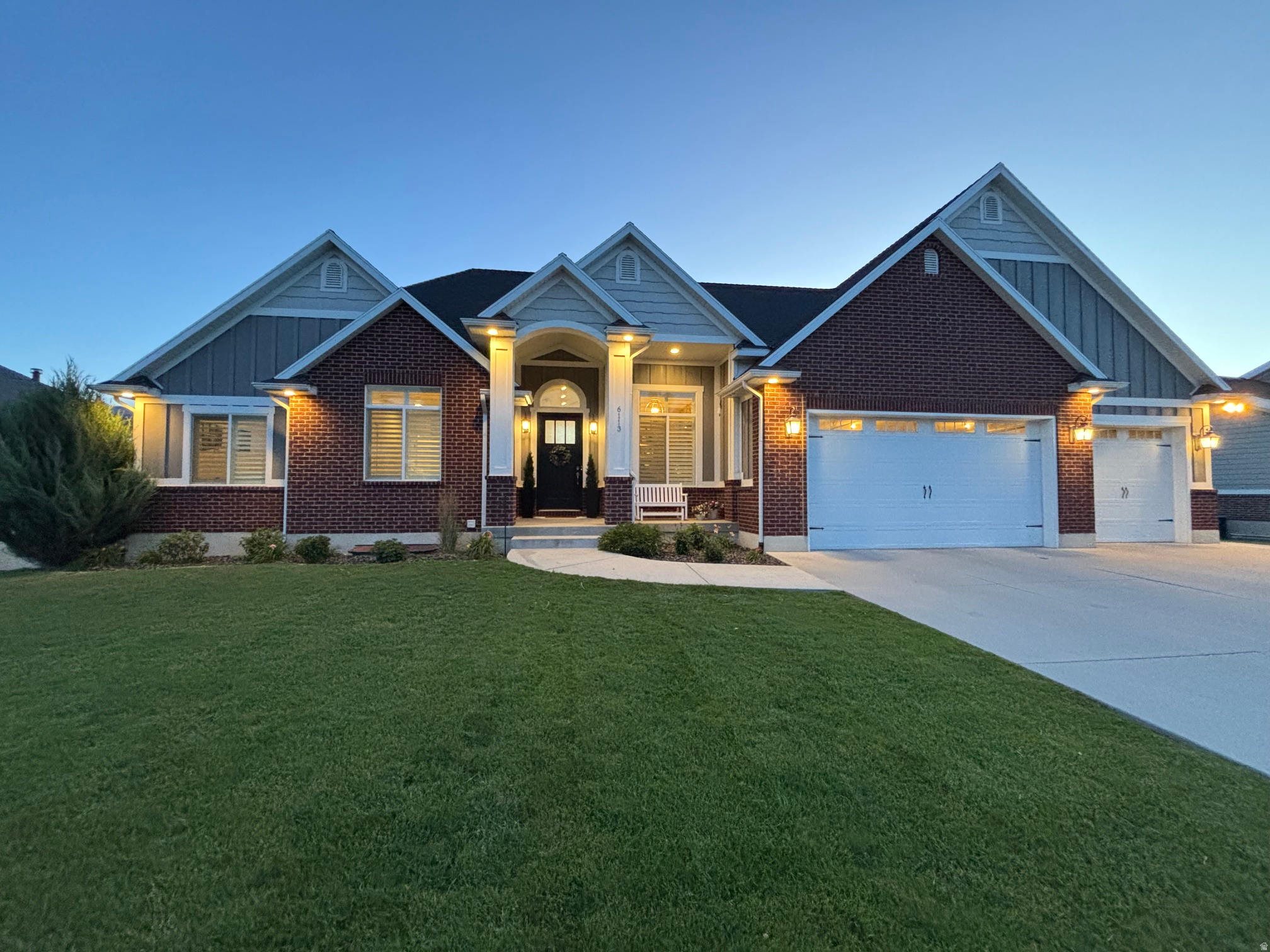 Welcome to this beautifully maintained Mountain Green home offering 5,054 square feet, 7 bedrooms, 4.5 bathrooms, and a thoughtfully designed floor plan on a professionally landscaped 0.33-acre lot.  The main level features wide-plank wood-look porcelain tile, vaulted ceilings, expansive windows, and a floor-to-ceiling stone fireplace that fills the home with natural light and mountain views. The open layout connects the great room, dining area, and kitchen, creating a comfortable space for everyday living and entertaining.  The kitchen includes custom cabinetry, quartz countertops, an oversized island, and a spacious walk-in butler's pantry with a prep sink and abundant storage.  The main-level primary suite provides a comfortable retreat with a spacious ensuite bathroom featuring a soaking tub, separate shower, vanity with a built-in makeup area, and a walk-in closet.  The fully finished basement provides additional living space with a second full kitchen, large family room, dedicated workout room, multiple bedrooms, and a golf simulator/theater room.  Outside, the backyard offers something for everyone. An oversized deck provides a great place to relax and take in the mountain views, while the built-in play area with two slides off the deck creates a fun space for kids. The professionally landscaped yard also features a sports court for basketball and  pickleball, a synthetic putting green, an in-ground trampoline, and plenty of space for entertaining and outdoor activities.  Additional features include:  Owned solar system  Fully finished basement with second kitchen  Dedicated fitness room  Golf simulator/theater room  Custom built-ins  Plantation shutters  Ample storage throughout  Automatic sprinkler system  Located adjacent to Mountain Green Elementary School and just minutes from Snowbasin Resort, Pineview Reservoir, hiking and biking trails, golf, and convenient access to Ogden and Salt Lake City.  This home offers a rare combination of space, functionality, and outdoor amenities in one of Mountain Green's most desirable neighborhoods.   Square footage figures are provided as a courtesy estimate only and were obtained from house plans.  Buyer is advised to obtain an independent measurement.