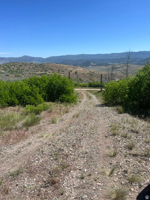 Escape the hustle and unplug in this serene location, with beautiful mountain views, and 5 acres of privacy! This land is perfect for a summer getaway in the RV or a cabin and located in the gated subdivision of Oaker Hills. The property features three water hookups for RV's and an RV sewer clean out. Solar is available, just needs an inverter connected. There is a Conex storage unit onsite, as well as a stick build shed. Septic tank has been installed, is hooked up and working. There is a foundation that has been poured and set for a future cabin. With year-round access, depending on the winter in the area, snowmobile/snowcat may be needed to reach the property.