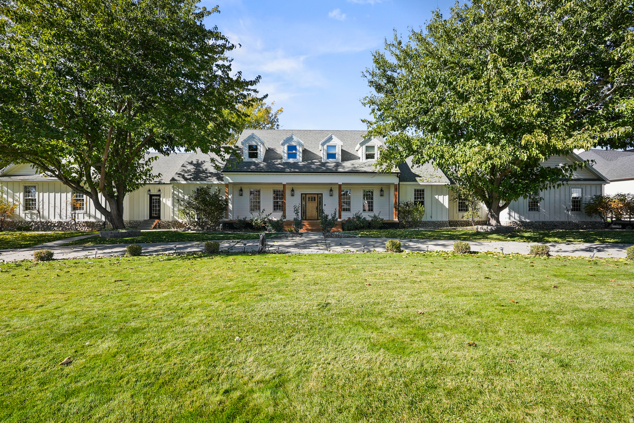 Welcome to this exceptional equestrian property set on 1.47 beautiful acres! This property offers panoramic mountain views and refined amenities. This spacious executive estate offers inviting living areas filled with abundant natural light and comprises seven well-appointed bedrooms and five bathrooms. The primary suite is complemented by a private sitting area, adjoining nursery and a luxurious en suite bath with direct hot tub access, providing a tranquil escape.  The remodeled kitchen is equipped with high-end Wolf appliances, a Sub-Zero refrigerator, custom cabinetry, granite countertops, exposed wood beams, an elegant brick backsplash, and a functional butler's pantry, ideal for culinary enthusiasts and entertaining.  The grounds are thoughtfully configured for equestrian use, offering fenced pastures and extensive riding areas set against the picturesque Wasatch Front mountain range. The acreage allows for further customization, with potential to add a pool or pickleball courts, making it a versatile canvas for future enhancements. The private backyard, including large deck and pergola covered patio, creates an inviting atmosphere for relaxation or gatherings, enhanced by remarkable vistas in all directions.  Located within the sought-after Bonanza Acres neighborhood, this estate offers convenient proximity to the South Jordan Equestrian Center, local schools, parks, shopping, and dining options. It harmoniously combines comfort, convenience, pastoral living, and extraordinary natural scenery.  Prospective buyers are invited to schedule a private tour to fully appreciate the exceptional lifestyle and features this distinguished 1.47-acre horse property provides.  Square footage figures are provided as a courtesy estimate only. Buyer to verify all.