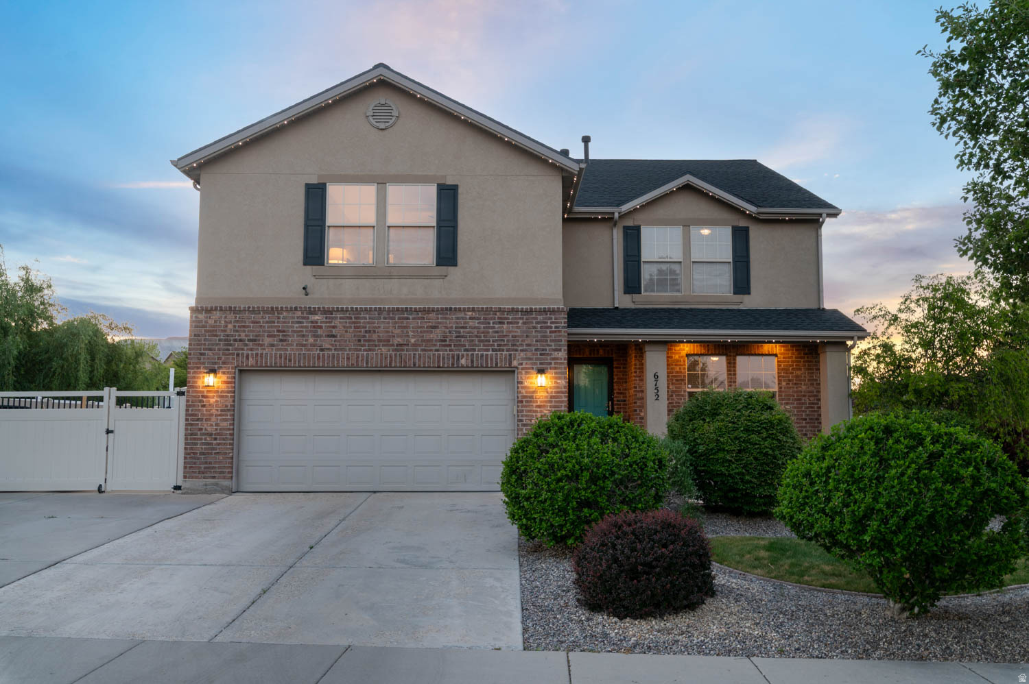 Beautiful two-story home in a desirable Herriman neighborhood featuring 6 bedrooms and 3.5 bathrooms on a corner lot with stunning mountain views. The custom kitchen showcases upgraded high-end appliances, a custom-built pantry, and a large island that flows seamlessly into the open main living area, creating the perfect space for everyday living and entertaining. The home also features a spacious primary suite with an ensuite bath, large secondary bedrooms with walk-in closets, that offers a comfortable private retreat. The loft and dedicated office with new flooring complete the home's versatile and functional layout. An expansive basement with a second kitchen area offers incredible flexibility for entertaining or multi-generational living. Step outside to enjoy the oversized backyard with mature landscaping, a gazebo, fire pit, automatic sprinkler system, permanent exterior lighting, and convenient sliding glass door access. Additional updates include fresh paint, two newer furnaces and A/C units, a brand-new roof, newer water heater, ethernet wiring throughout, a security system, and RV parking. With beautiful finishes, thoughtful upgrades, and a fantastic location, this is a home you won't want to miss!