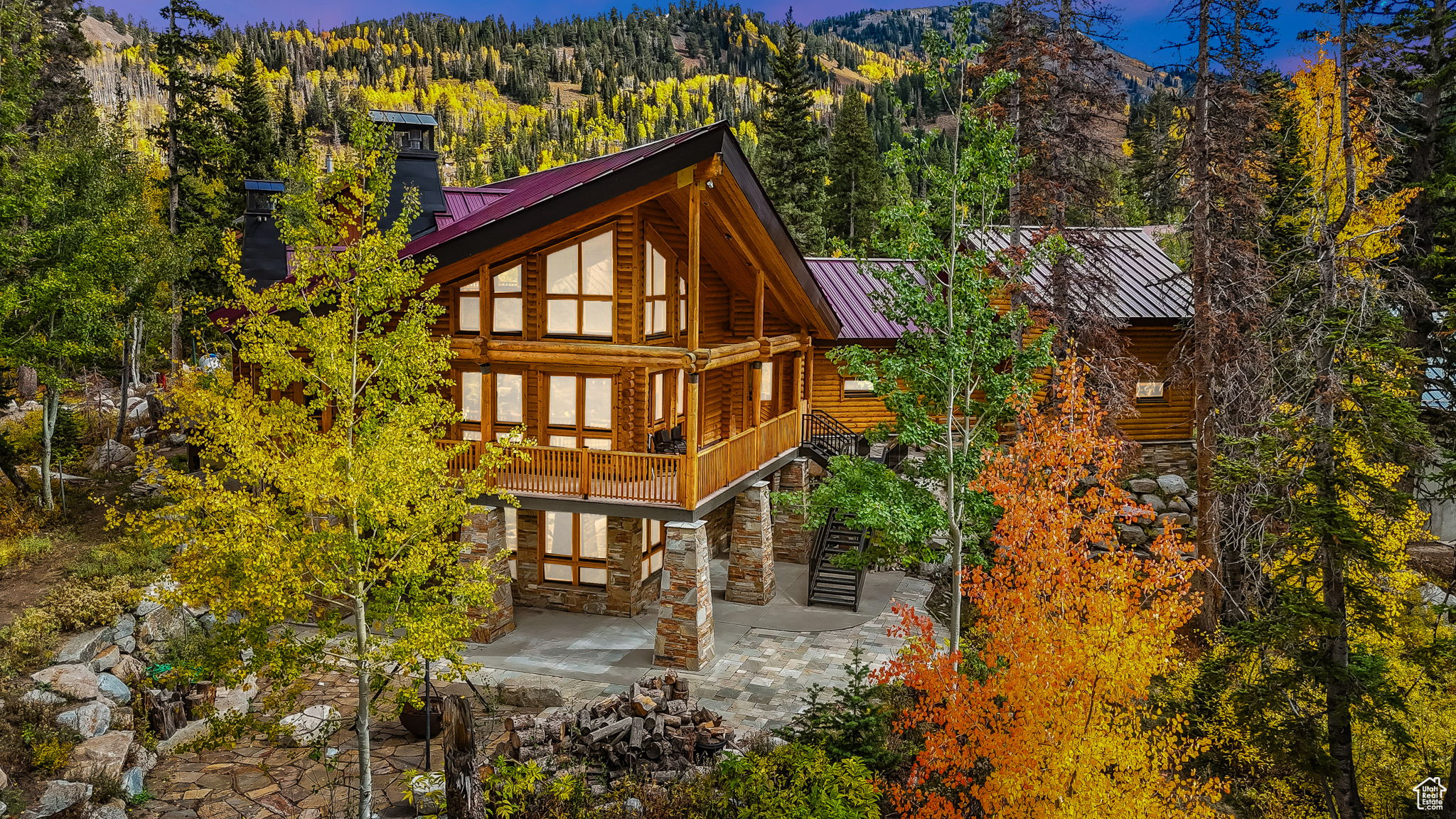 Welcome to this turn-key mountain retreat on the coveted Brighton Loop, offering breathtaking mountain and forest views. Enjoy year-round access on a large, low-maintenance lot with Cottonwood Creek, an outdoor spa hook-up, and a cozy raised fire pit for evenings under the stars. Close to Brighton Resort and Silver Lake for skiing, hiking, biking, and fishing. Inside, a vaulted great room with a dramatic rock fireplace anchors the home, joined by a chef's kitchen with Viking appliances & granite. The main-level primary suite features its own fireplace, steam shower, jetted tub, walk-in closet, and a fireplace in the main bath. Upstairs, a spacious loft with private deck offers stunning views. The walk-out lower level adds a second kitchen, recreation room with fireplace, sauna, and guest suites. Relax on the rear deck or use the heated 3+ car (1,100 sq ft) garage w/220V. Fire sprinklers, instant hot water, new roof & serviced boiler (2025), and zoned heating complete this rare find.  Buyer to  verify all MLS information including square footage and all details as part of their due diligence.