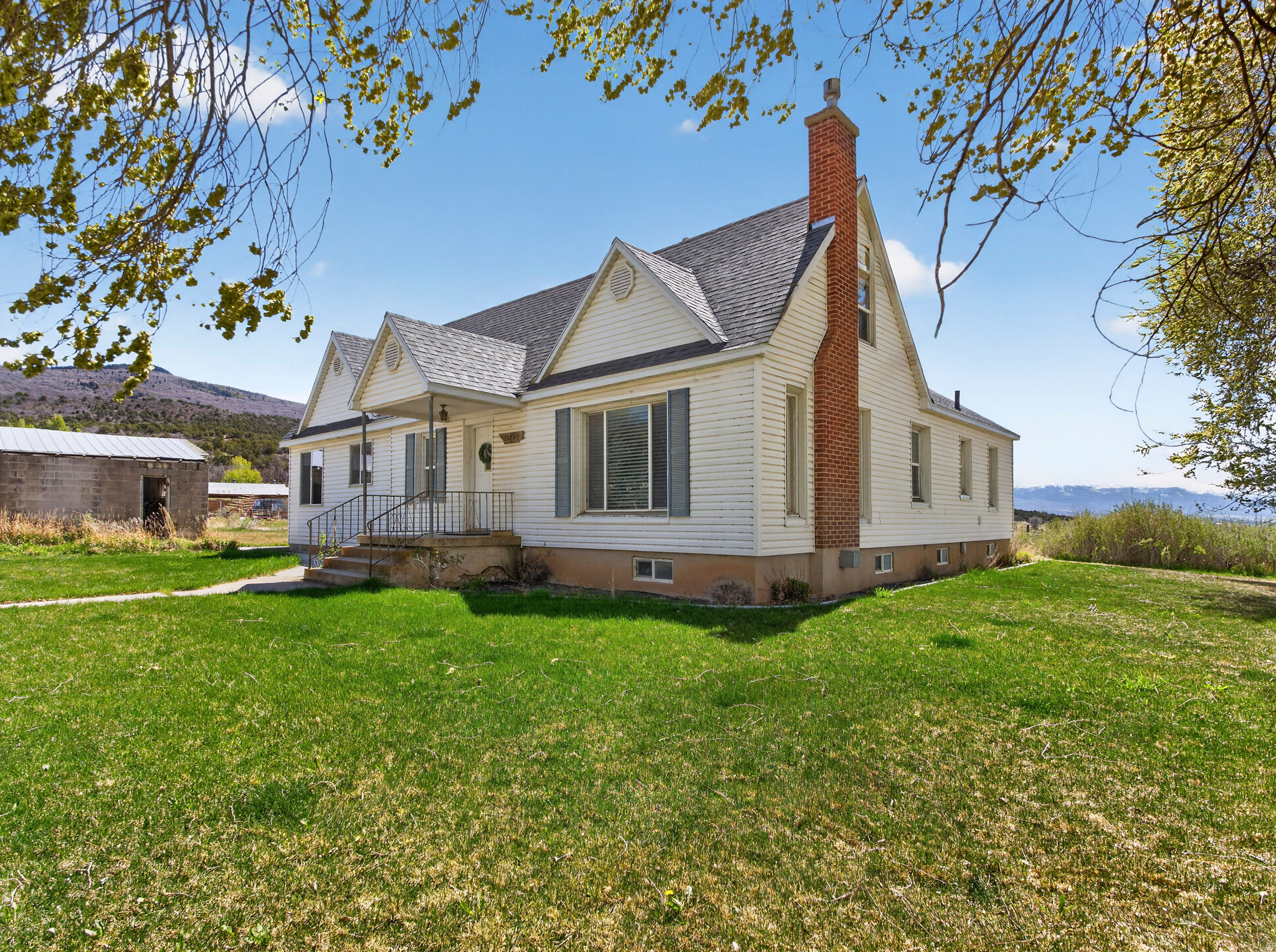 CHARMING FARMHOUSE, nestled in the peaceful community of Fairview, Utah. Surrounded by mountain views and open skies. Located just minutes from Fairview Canyon, Skyline Drive, camping, hiking, fishing, hunting, ATV trails, and snowmobiling. The open-concept family room and kitchen create a spacious, inviting atmosphere perfect for entertaining. The primary bedroom boasts a propane fireplace, an en suite bathroom with a large jetted bathtub, a separate, doorless walk-in shower, double sinks, and a walk-in closet. Also on the main floor, you will find an additional bedroom, a full bathroom, a large laundry room, an office/den with built-in locker-style storage, and a living room. On the upper level, you will find two additional bedrooms and an unfinished bonus room with dormer ceilings that offer a unique combination of natural light, character, and architectural interest just waiting for you to transform that space into a retreat. The unfinished basement is a blank canvas offering tremendous potential to expand your living space. The addition was completed in 2010. New Roof and furnace in 2025. Square footage figures are provided as a courtesy estimate only and were obtained from a previous appraisal. Buyer and Buyer's agent to verify all information. A pre-approval letter from the lender or a POF must accompany all offers. ADDITIONAL LAND AVAILABLE. CALL AGENT FOR MORE INFORMATION.