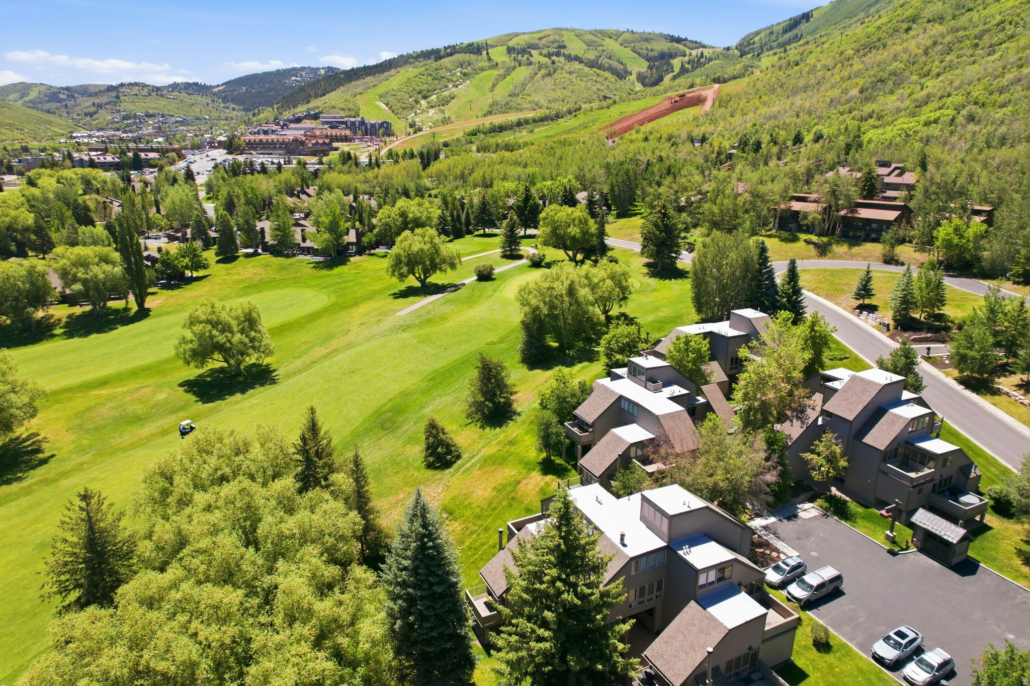 Perfectly positioned along the fairways of the Park City Municipal Golf Course, this exceptional residence offers one of the most coveted locations in Park City. Surrounded by mature trees, expansive green space, and beautiful golf course and mountain views, the setting provides a rare sense of privacy and tranquility while remaining within easy walking and biking distance of skiing, trails, shopping, dining, Park City Mountain Village, and Silver Star Plaza. Updated in approximately 2017, the home features a spacious and functional floor plan with 4 bedrooms, 3 bathrooms, a great room, and a separate family room. Multiple decks provide inviting outdoor living spaces, while additional storage beneath the unit offers room for all your mountain gear. A rare opportunity to enjoy the ultimate Park City lifestyle in an unbeatable in-town location.