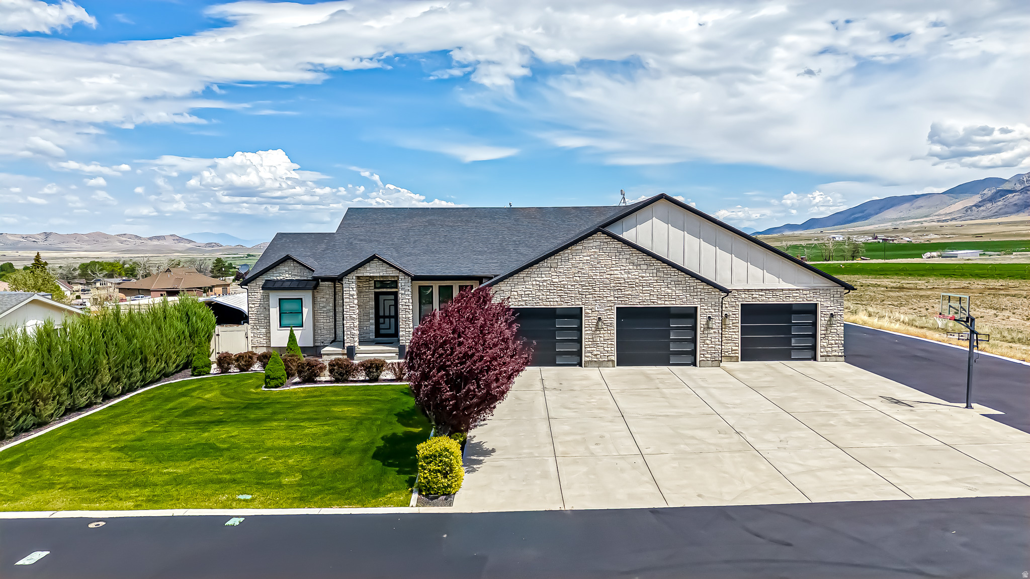 Rare opportunity to own one of Mona's most stunning custom-built residences  the builder's own personal home, crafted with uncompromising quality and thoughtful details. Nestled in Mona city this property enjoys full city utilities  no well or septic to worry about, a huge advantage in rural Juab County. Spanning an impressive 5,200 square feet with 5 spacious bedrooms, this entertainer's paradise delivers resort-style living on a generous 0.8-acre lot fully landscaped for low-maintenance beauty. Wake up to and relax with jaw-dropping panoramic views of majestic Mount Nebo.  Key highlights include State-of-the-art private movie theater for family movie nights, Massive 7-car garage perfect for vehicles, toys, or a workshop, Fun bunk room ideal for guests, kids, or grandkids, Expansive asphalt driveway and huge covered porch for outdoor enjoyment, Gourmet full custom chef's kitchen designed for effortless entertaining, Luxurious primary suite as your private retreat, Professional full landscaping throughout the grounds. This one-of-a-kind custom home blends everyday luxury, practical features, and small-town serenity. Don't miss your chance to own this beautiful home.