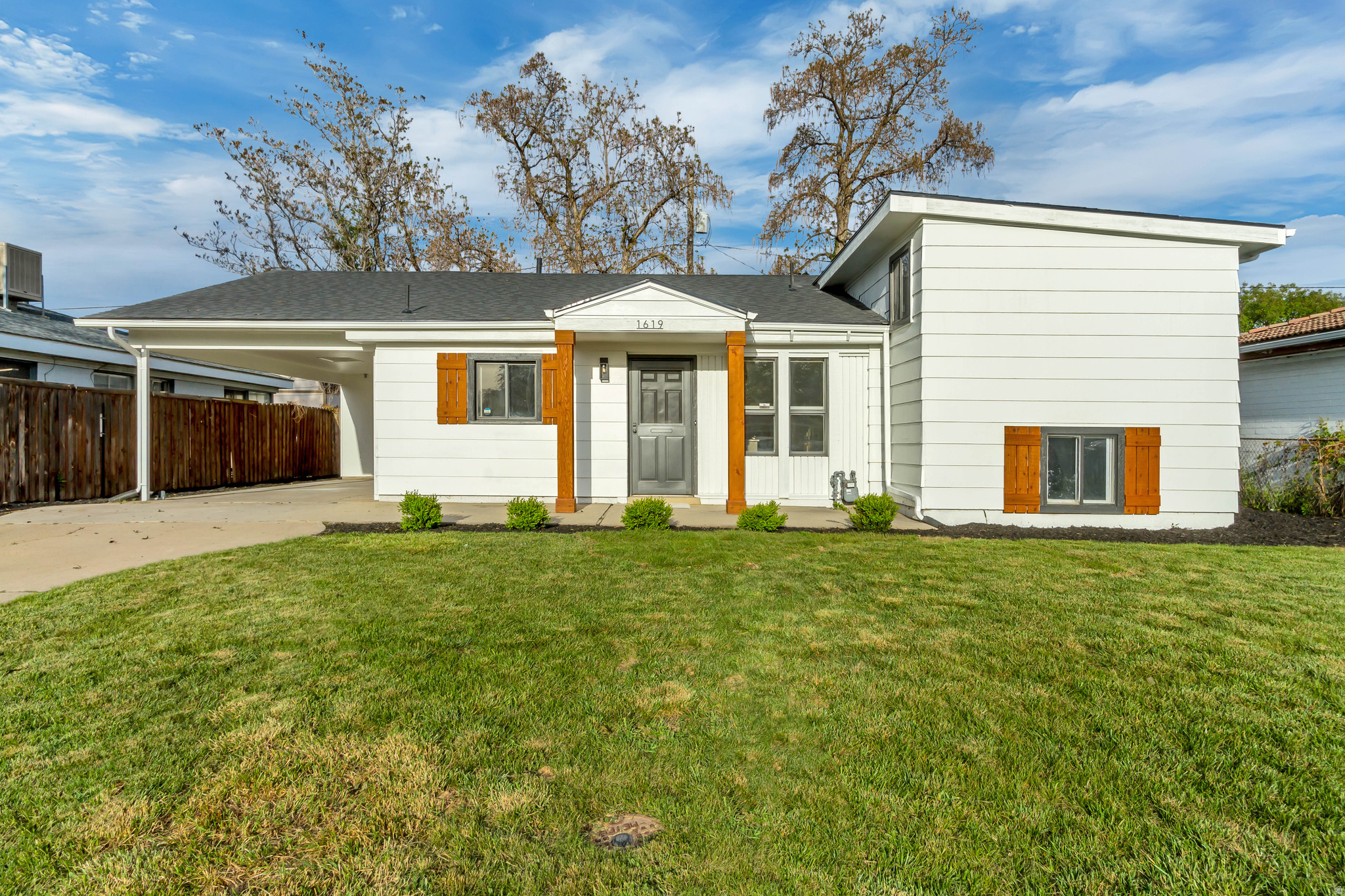 Beautifully remodeled multi-level home in Woods Cross! This 3-bedroom, 2-bath home offers 1,737 sq ft of clean, modern living with granite countertops, stainless steel appliances, and abundant natural light. The kitchen opens to the dining area with a functional layout that provides great separation of space.  Upstairs features a private bedroom with a bonus nook-perfect for an office or reading space-while the basement includes a spacious family room and large storage area. Recent updates include new cabinets, countertops, tiled shower, flooring, roof, paint, and lighting.  Enjoy a flat backyard with mature trees, just minutes from Hogan Park and convenient freeway access