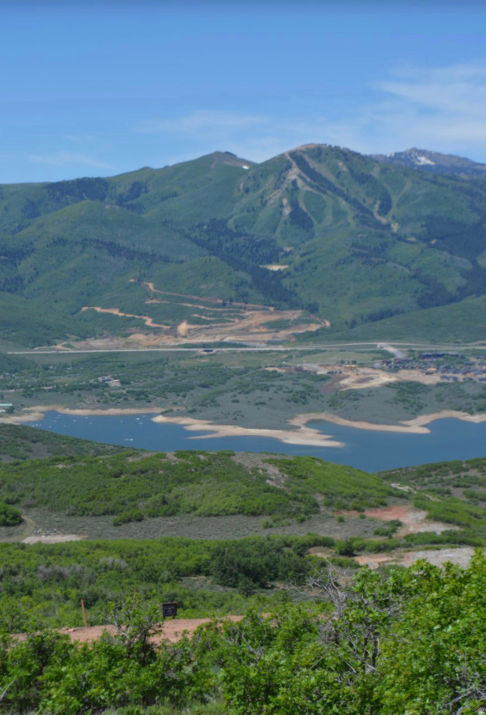 Centered high level view lot in Golden Eagle. Directly across from the Jordanelle Dam, the Timpanogos mountains in the distance and direct view of the ski runs of Deer Valley.  This lot is backing up to an open space parcel and has a gentle slope that sits high off the road to ensure privacy.  Golden Eagle spans more than 600 acres, with 25% preserved as open space. Residents will be able to access miles of private trails and will soon gather at the planned clubhouse featuring indoor/outdoor spaces, and community outdoor recreation. All of this is just 15 minutes to the new Deer Valley East Village, close to Park City's Historic Main Street, and only 35 minutes to Salt Lake International Airport.